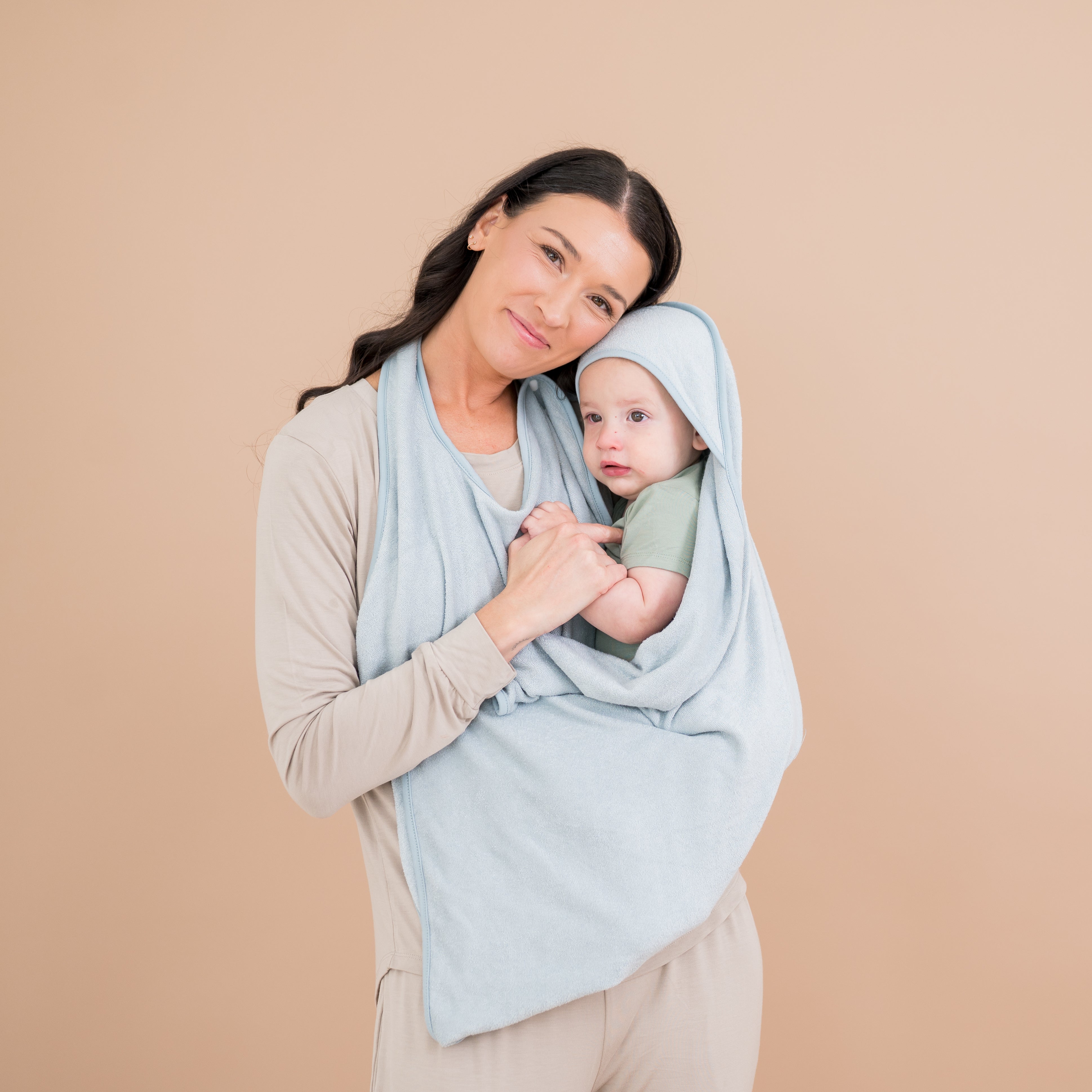 Mother holding child wrapped in Terry Apron Bath Towel in Fog blue