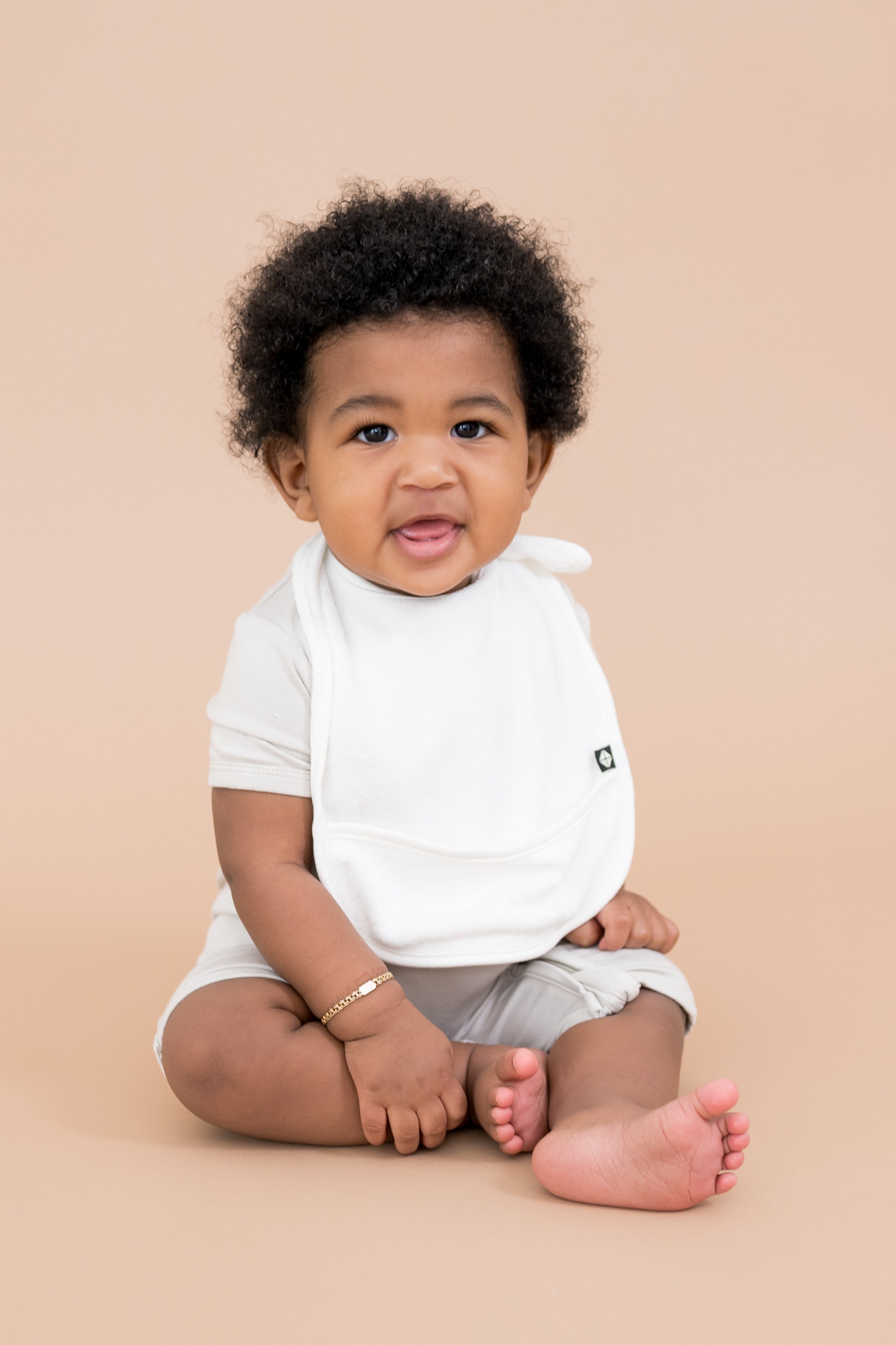 Baby wearing Adjustable White Terry Pocket Bib