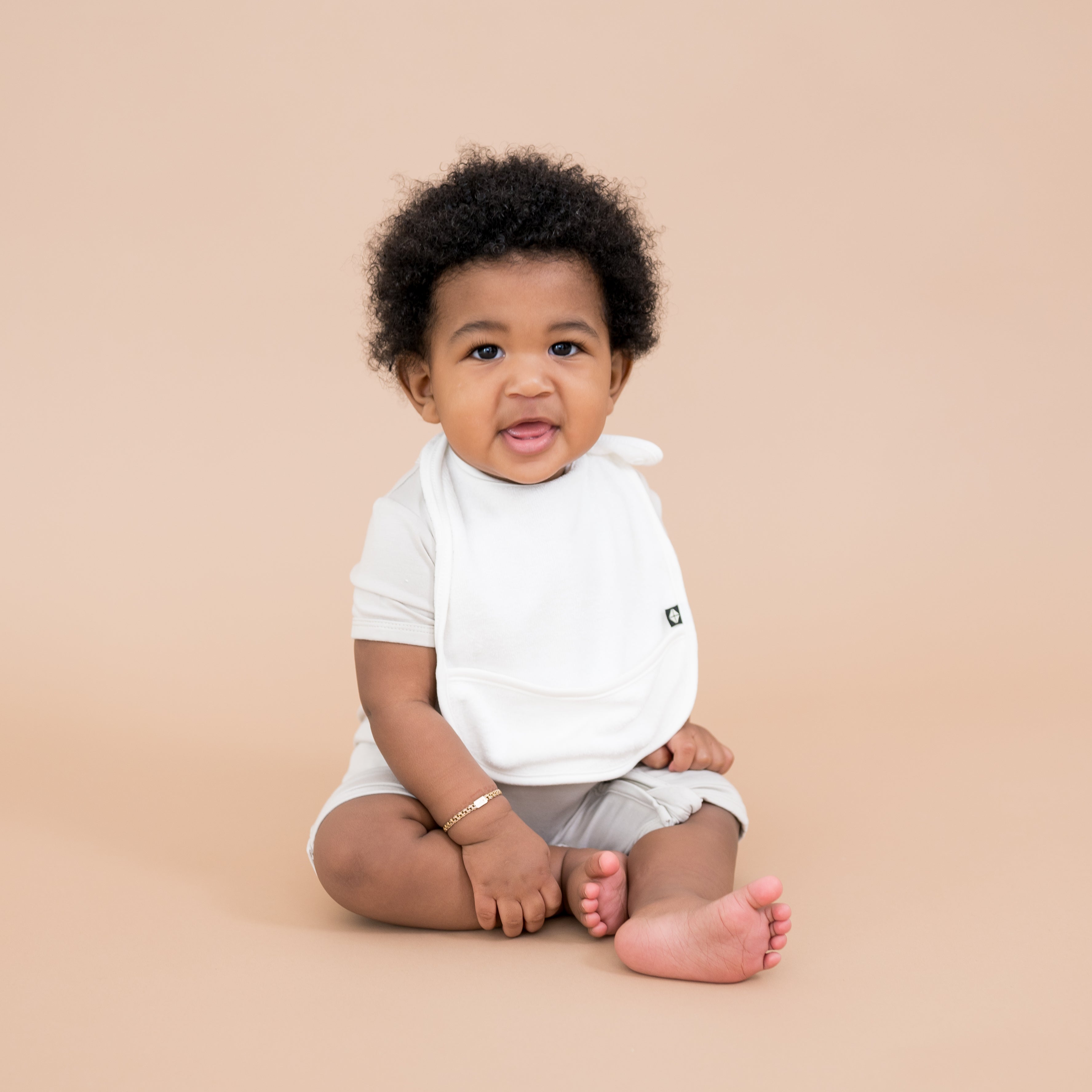 Baby wearing Adjustable White Terry Pocket Bib