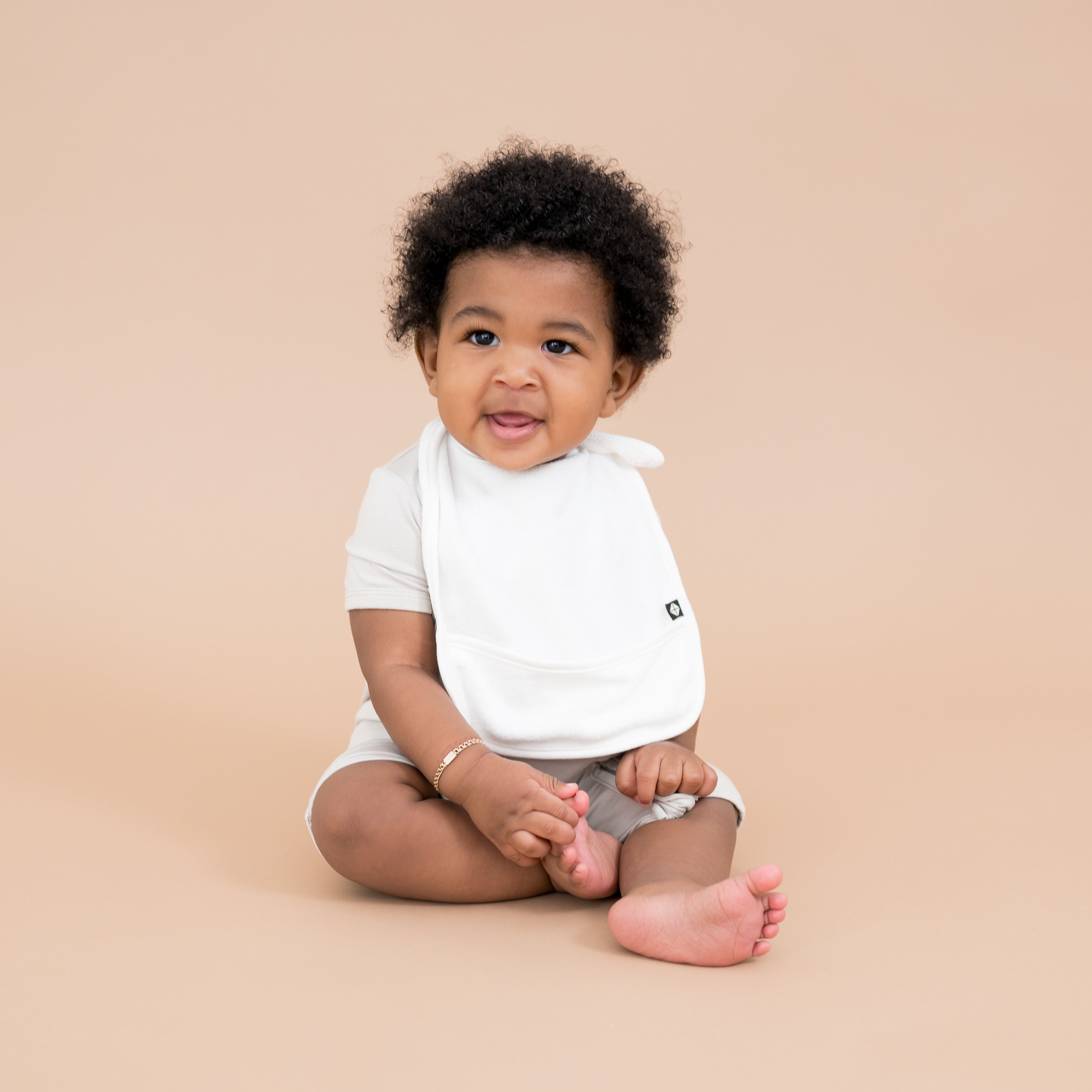 Baby wearing Terry Pocket Bib in Cloud