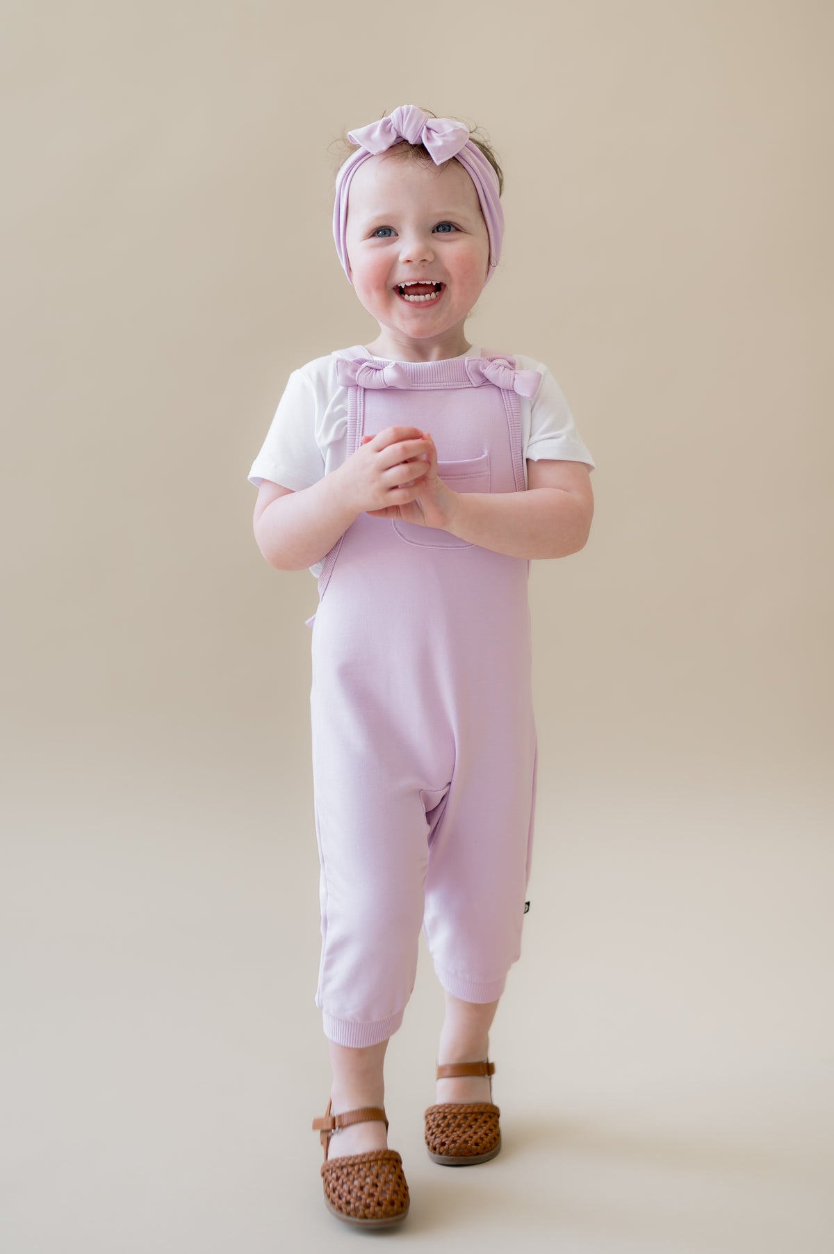 Young girl walking wearing the Overall in Thistle