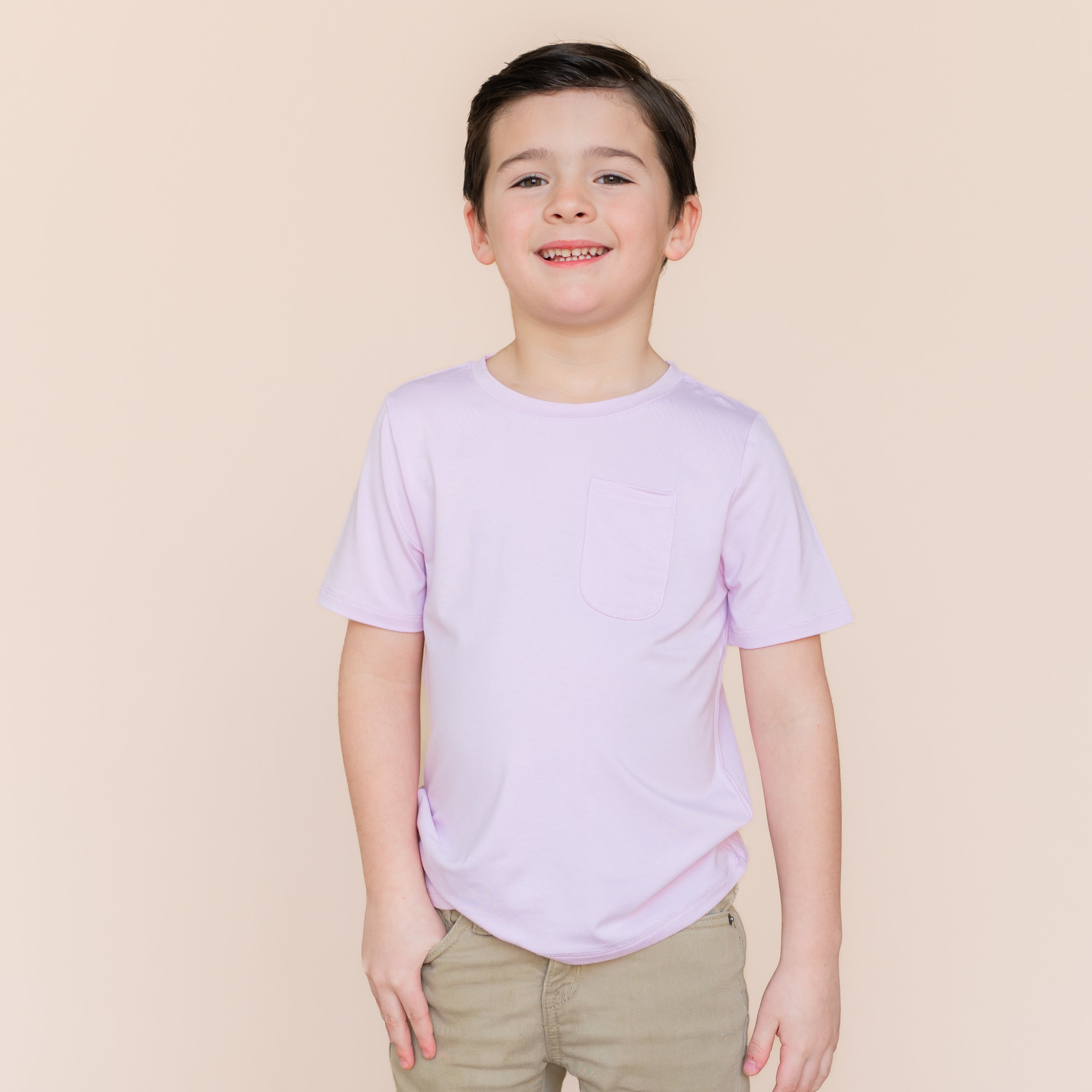 Young boy wearing the Toddler Crew Neck Tee in Thistle paired with khaki shorts