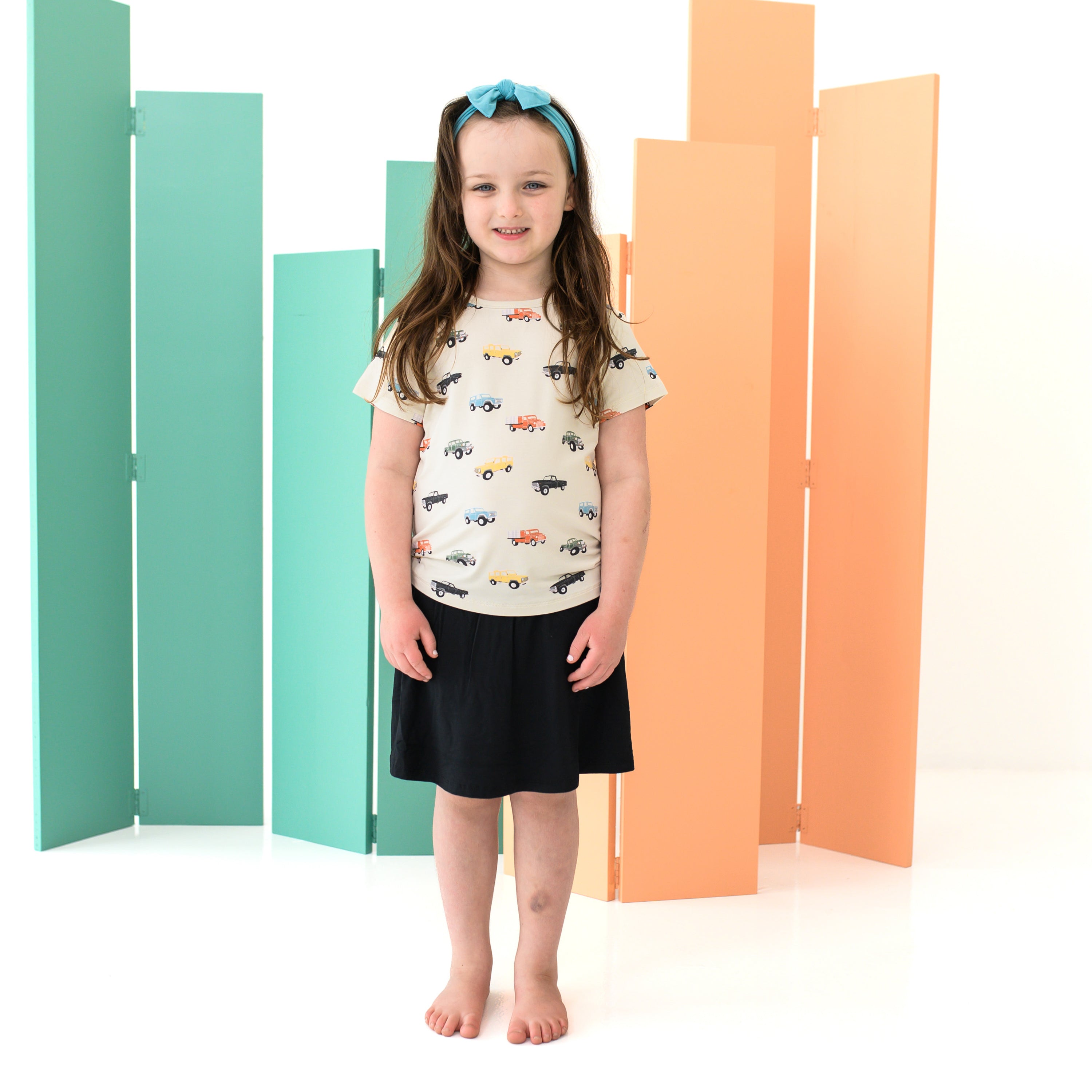 Girl wearing Toddler Basic Tee in Vintage Truck