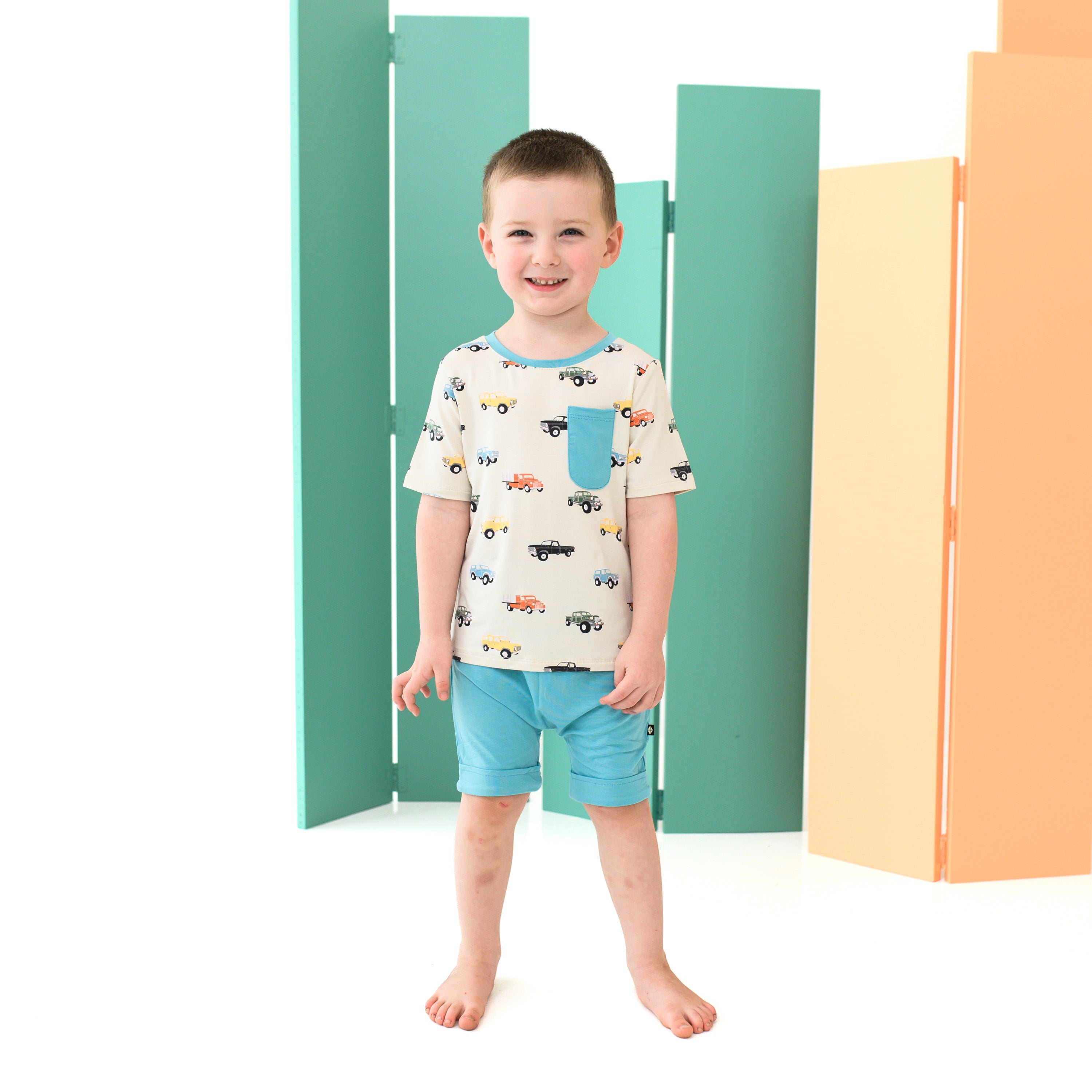 Boy wearing Toddler Crew Neck Tee in Vintage Truck