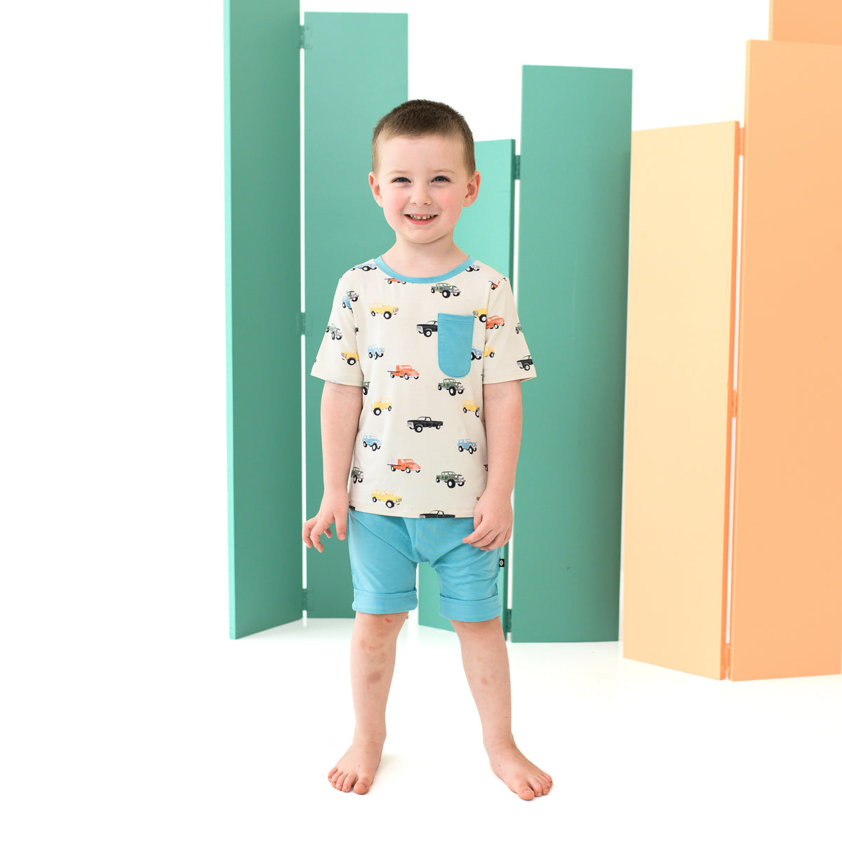 Boy wearing Toddler Crew Neck Tee in Vintage Truck