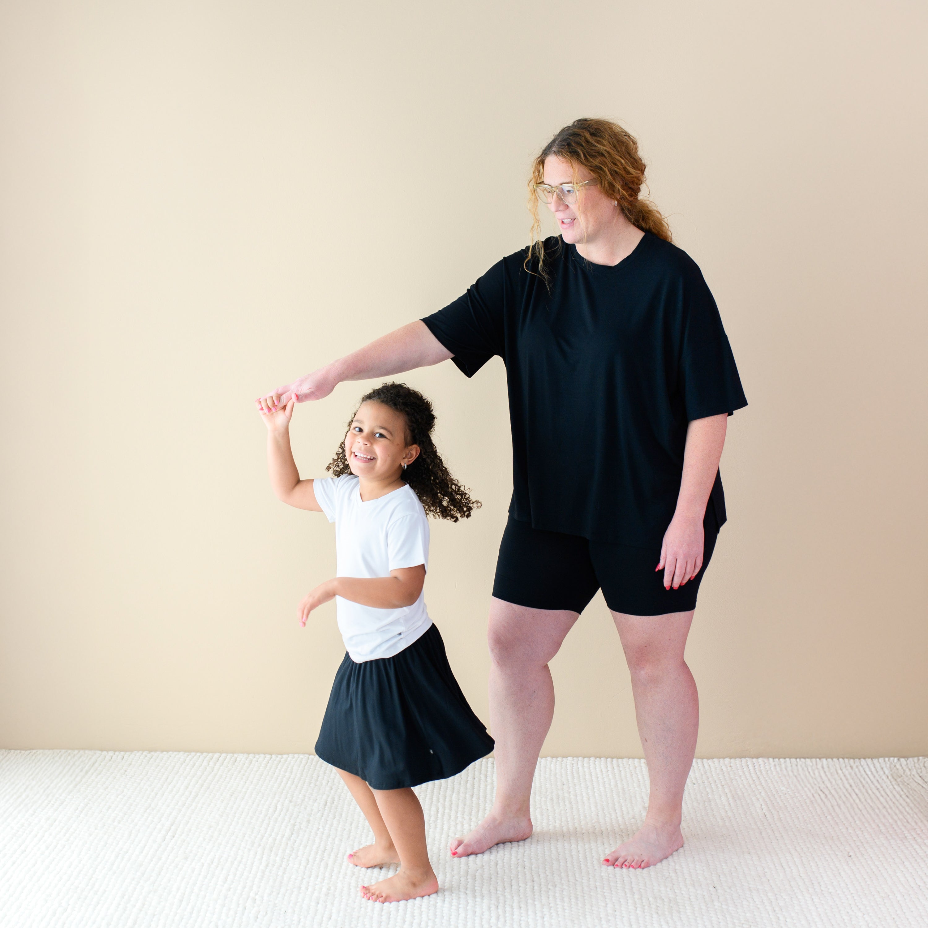 Toddler modeling Toddler Skort in Midnight with mom in Midnight Biker Short Set