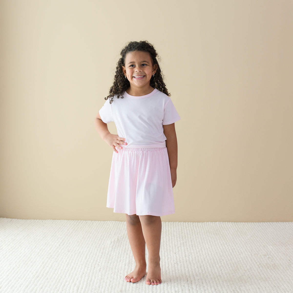 Toddler wearing Bamboo Skort in Sakura and basic tee