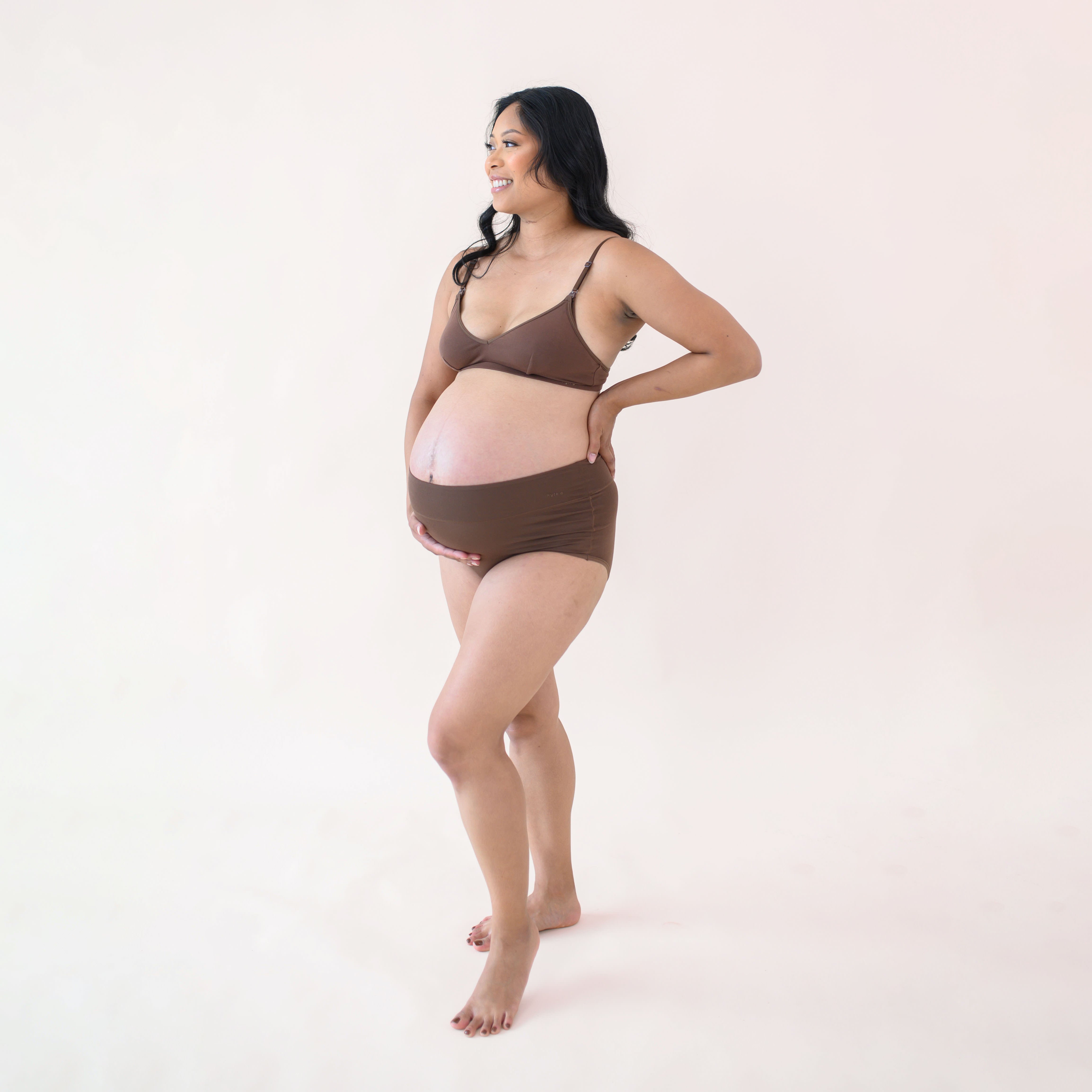 Pregnant woman modeling Women's High-Waisted Brief in Toffee and Nursing Bra
