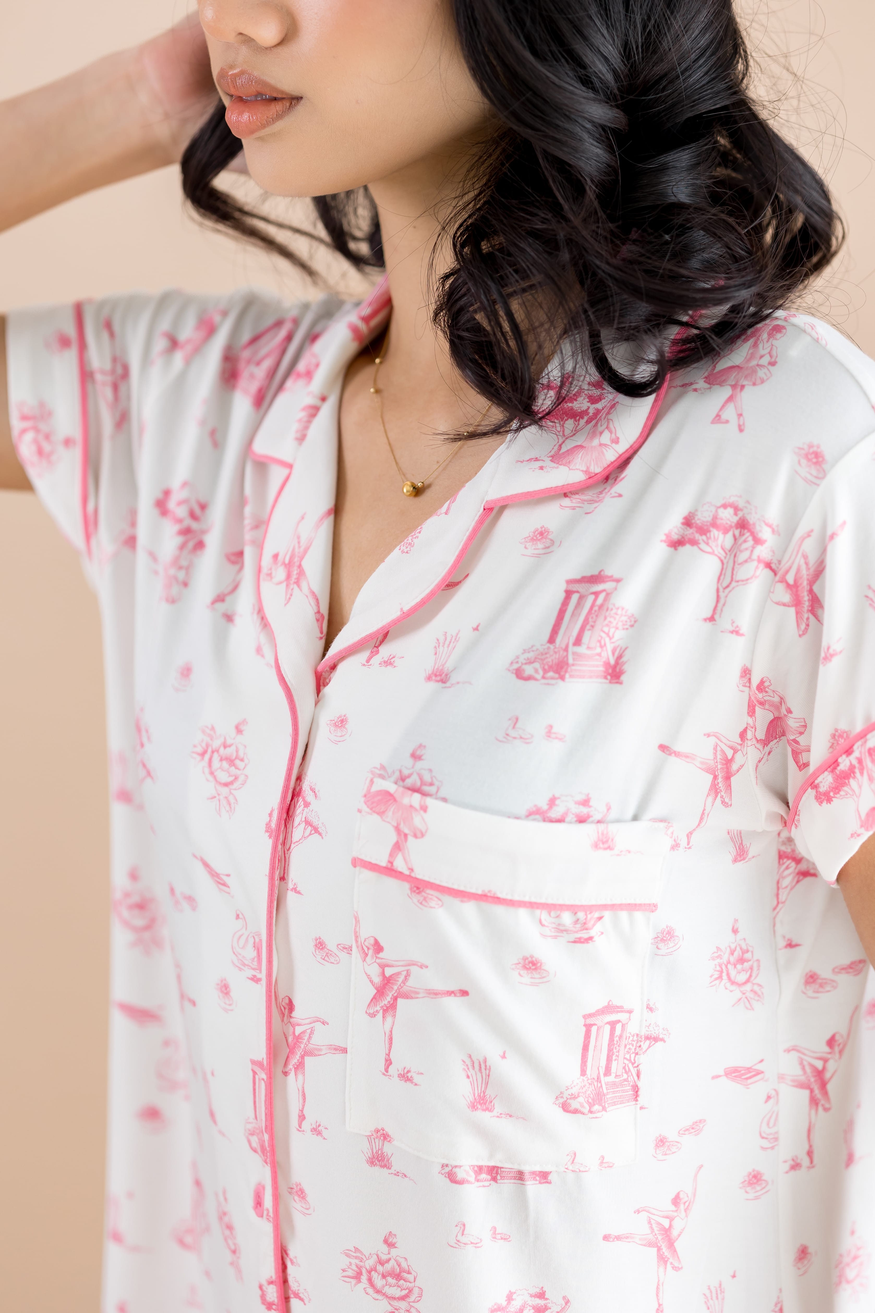 Close up of the collared neck, chest pocket and pink colored trim on the shirt of the Women's Short Sleeve Pajama Set in Toile Ballet