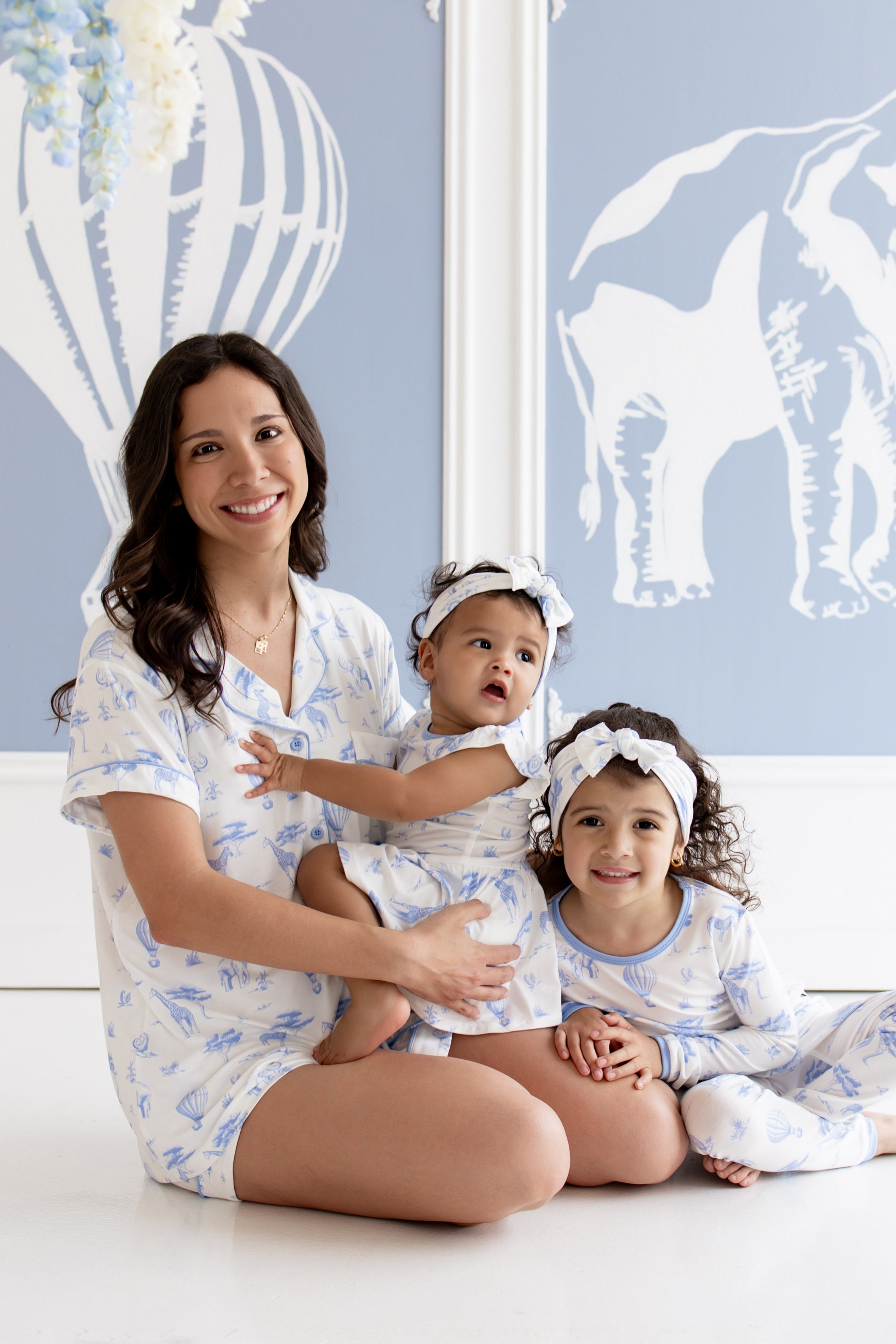 mom with 2 children in blue toile pattern pajamas