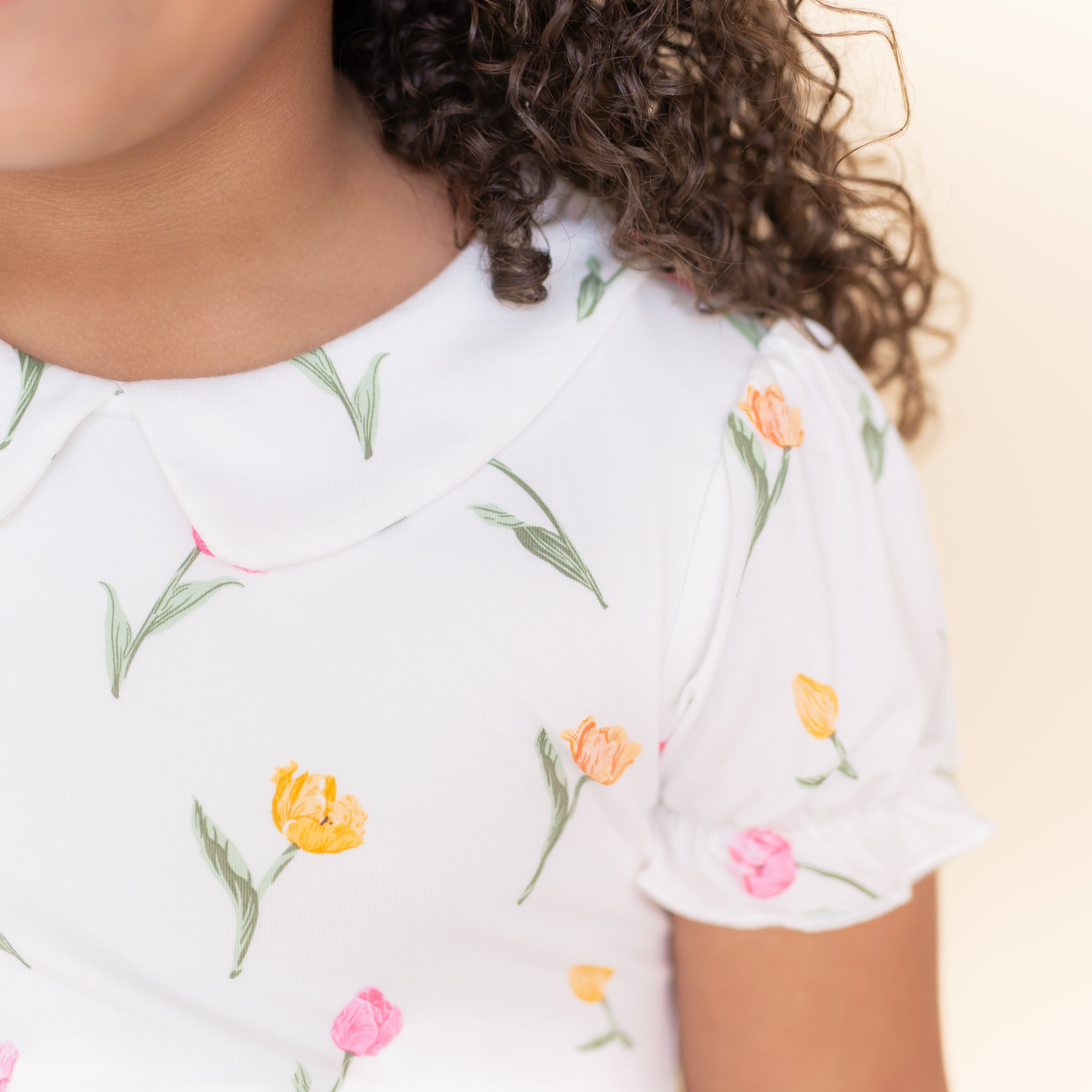 Close up of the puff sleeve and collared neckline on the Peter Pan Collar Dress in Tulip