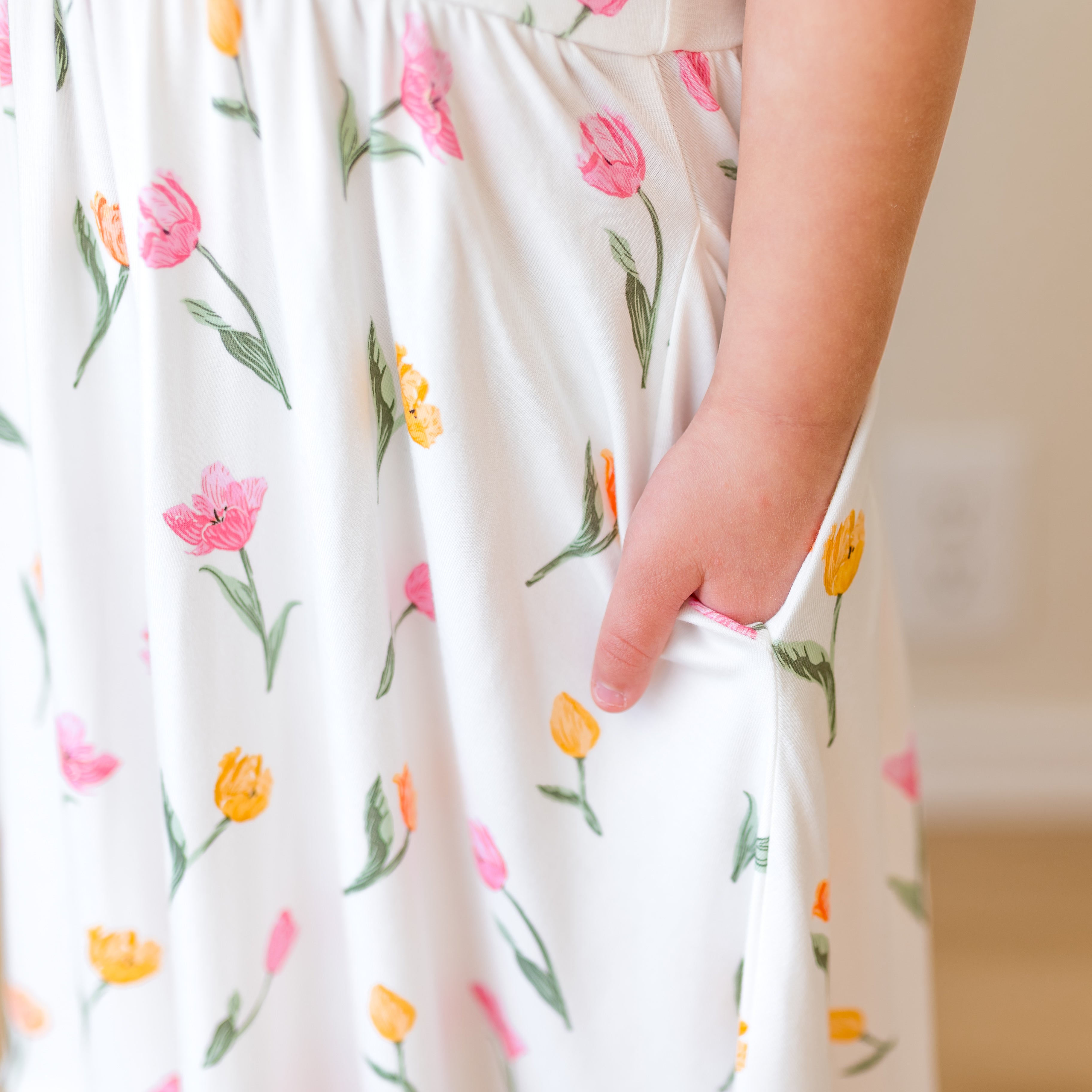 Close up of the pocket of the Puff Sleeve Twirl Dress in Tulip