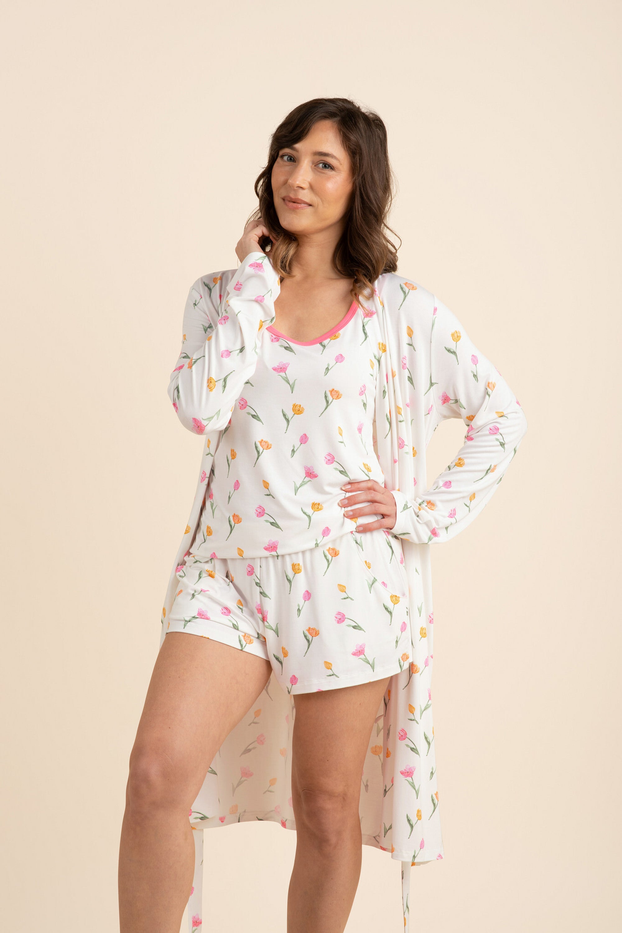 Female model posing wearing the Women's Lounge Robe in Tulip left open wearing the matching women's tank set