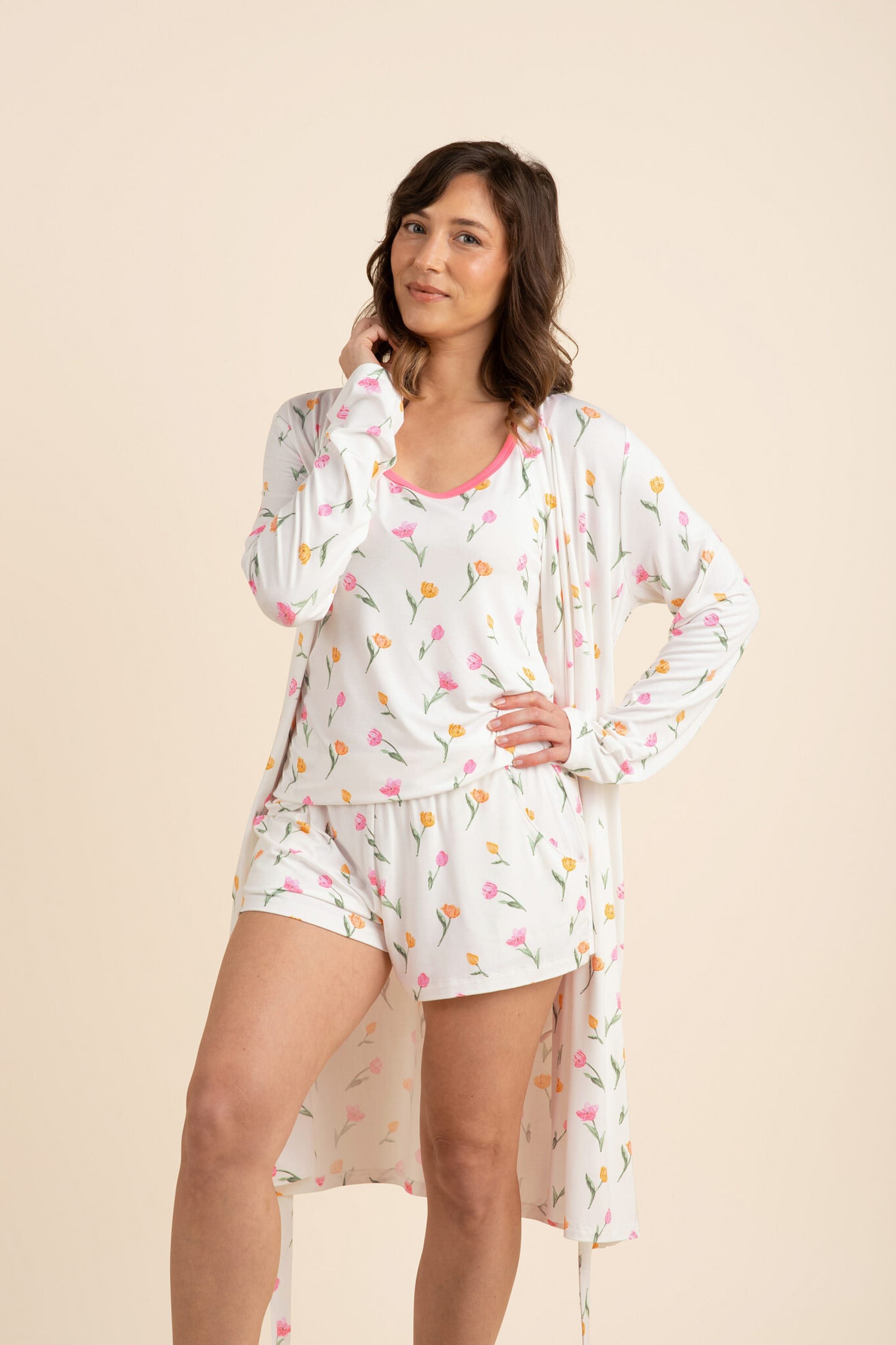 Female model posing wearing the Women's Lounge Robe in Tulip left open wearing the matching women's tank set