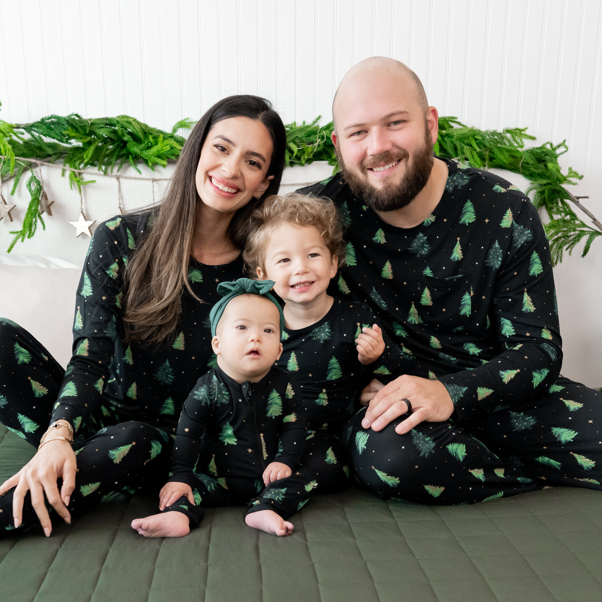Family of four in matching Twinkle Tree Pajama sets