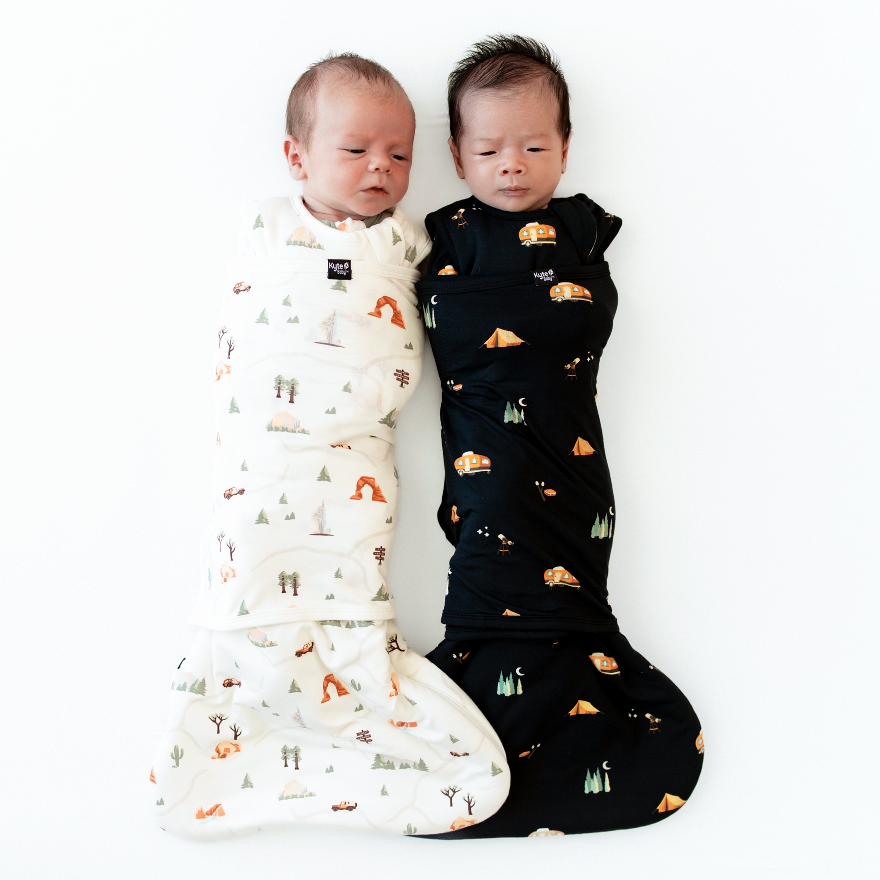 Newborn babies swaddled in the Sleep Bag Swaddler in Road Trip and Under the Stars