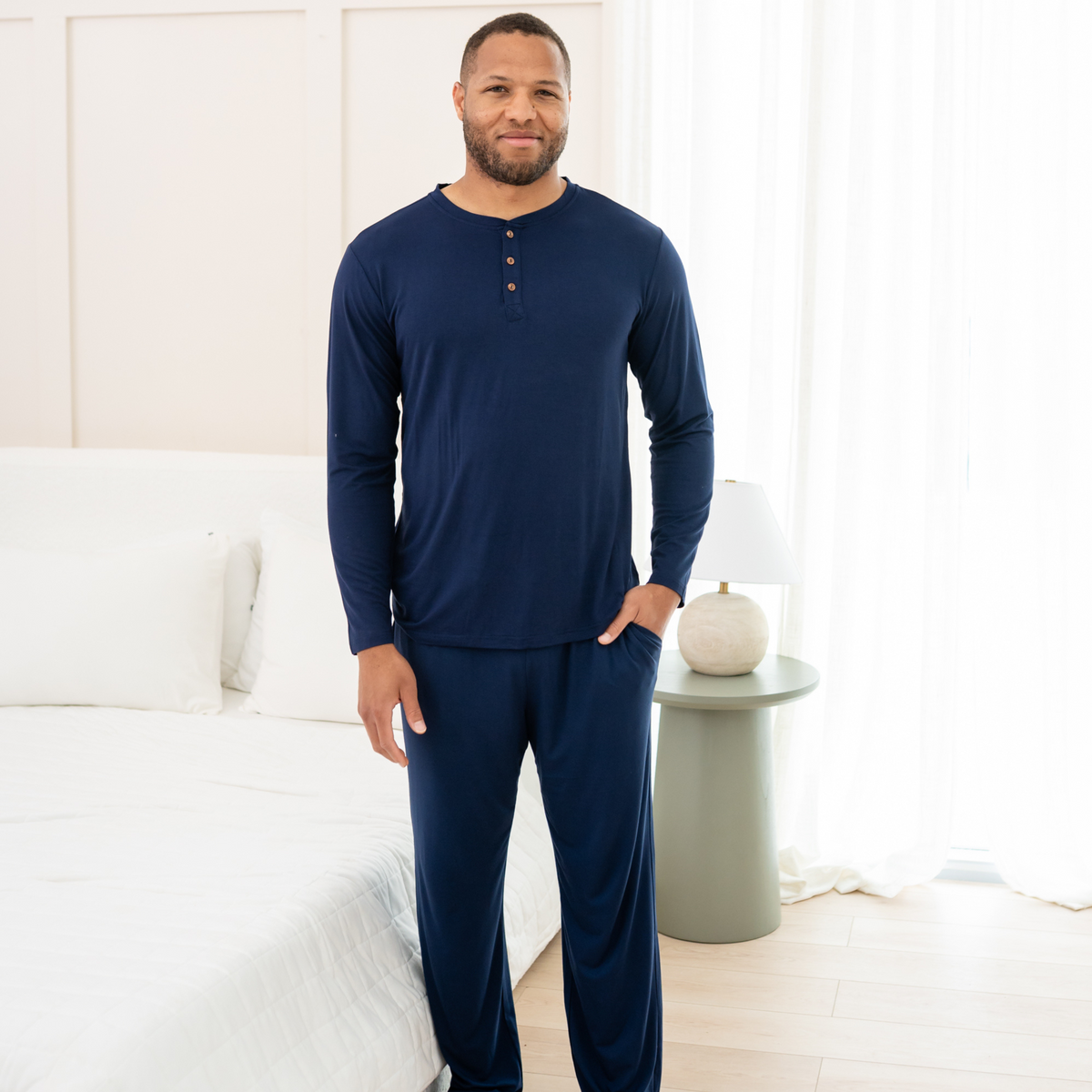 Male modeling Men's Lounge Pants in Navy and matching henley tee