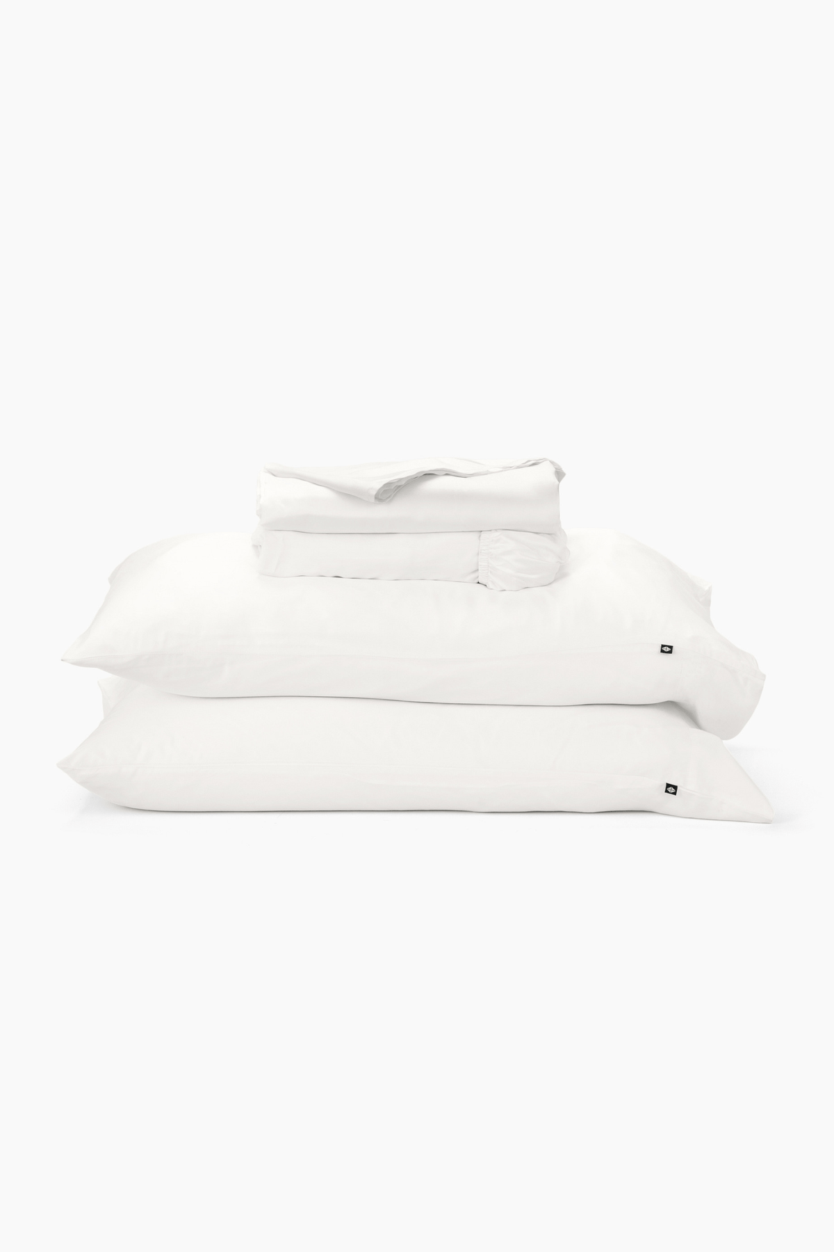 Stack of white pillows on a white background