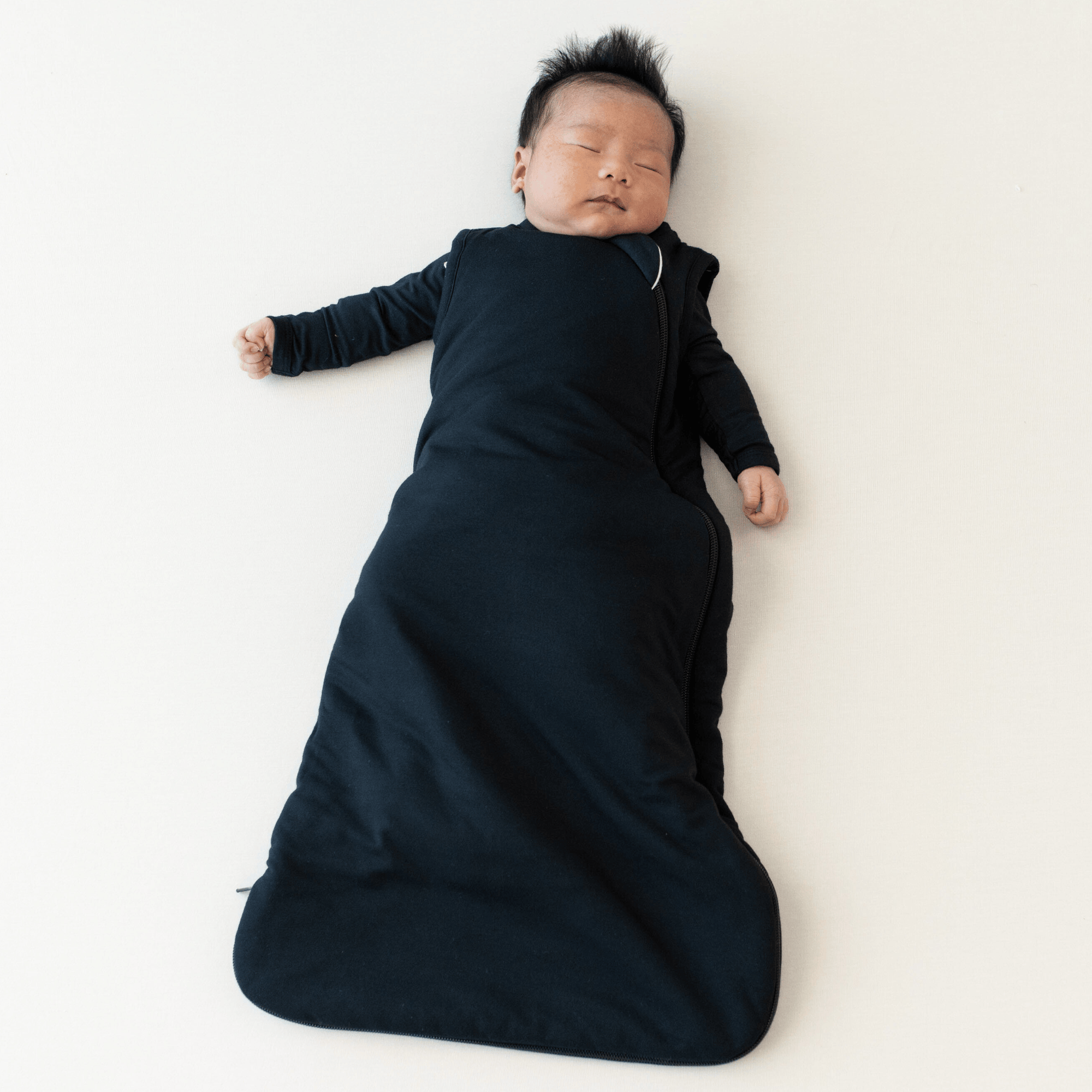 baby in 2.5 TOG sleep bag in midnight