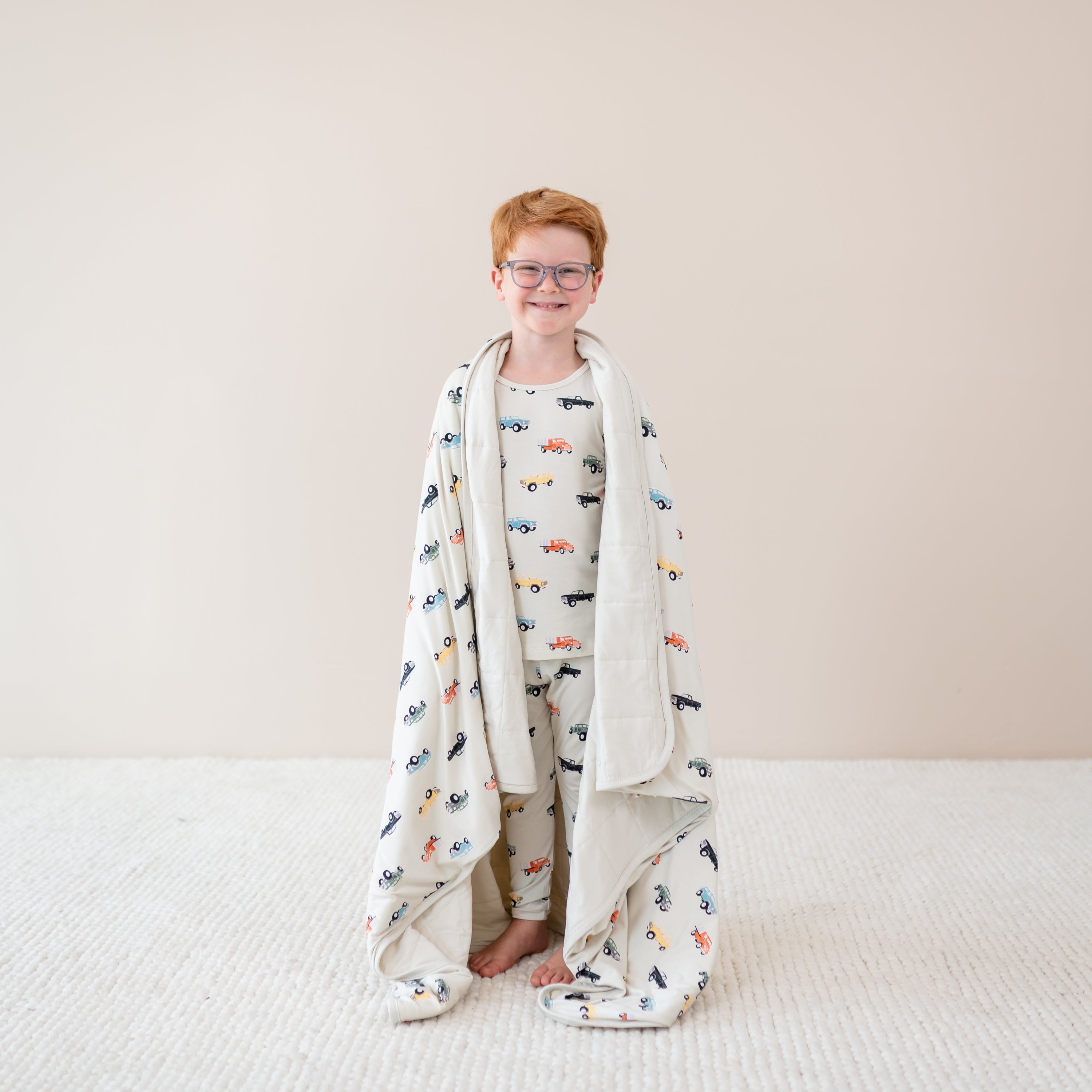 Child wrapped in Youth Blanket in Vintage Truck 1.0