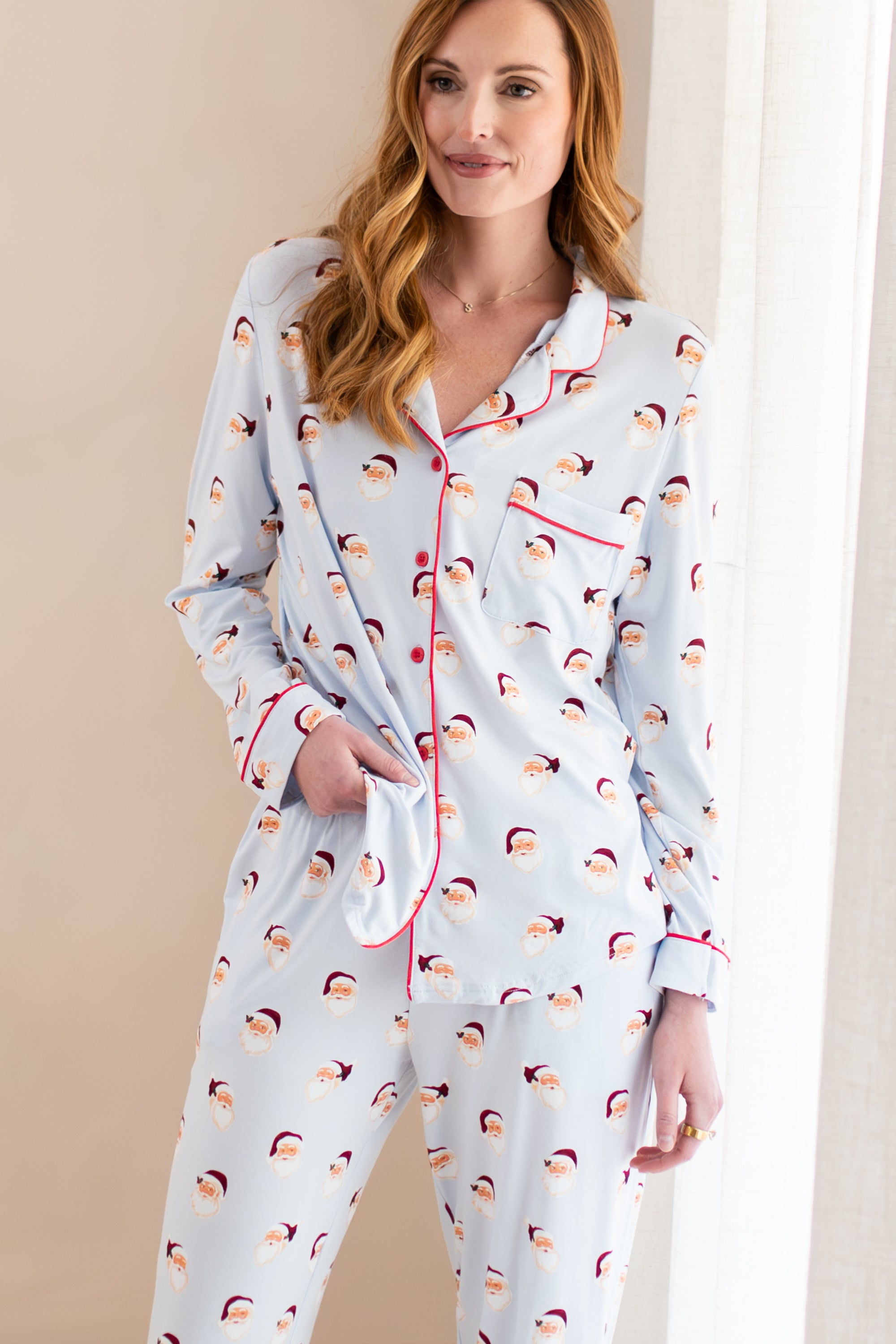 Female modeling the Long-Sleeved Women's Pajama Set in Vintage Santa
