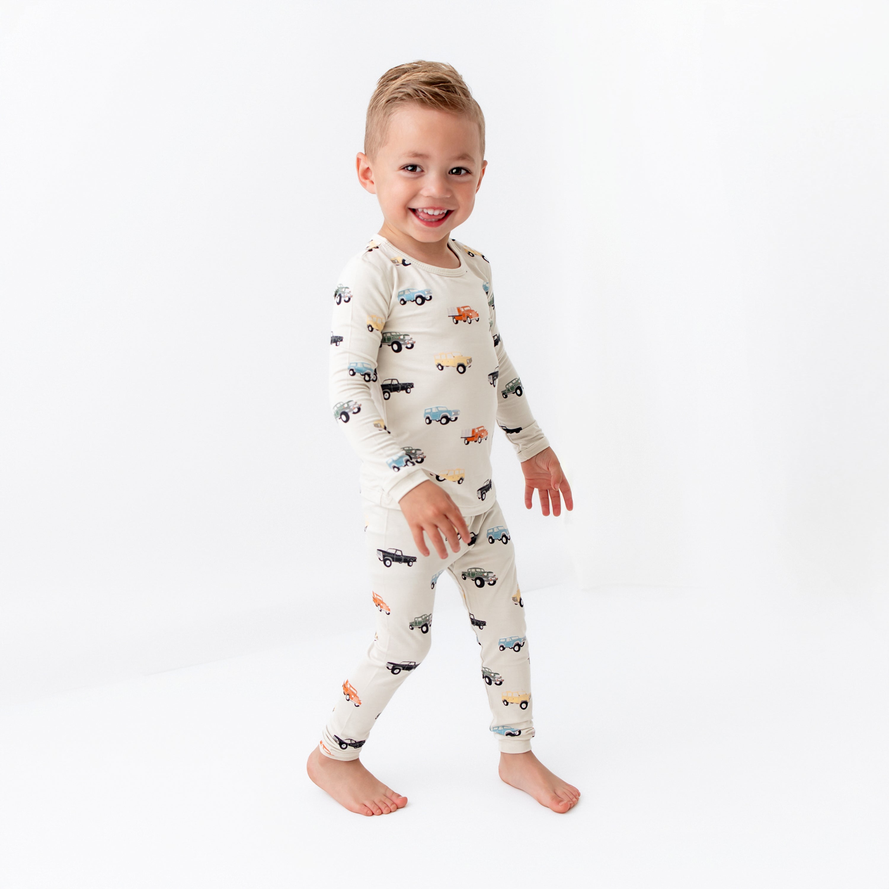 Child wearing Bamboo Long Sleeve Kids Pajamas in Vintage Truck