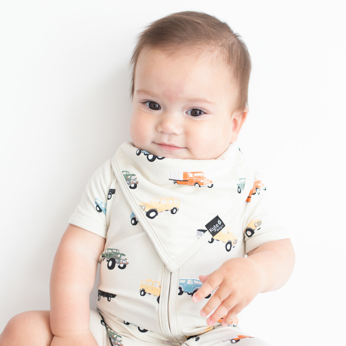 Infant wearing Bib in Vintage Truck with matching romper