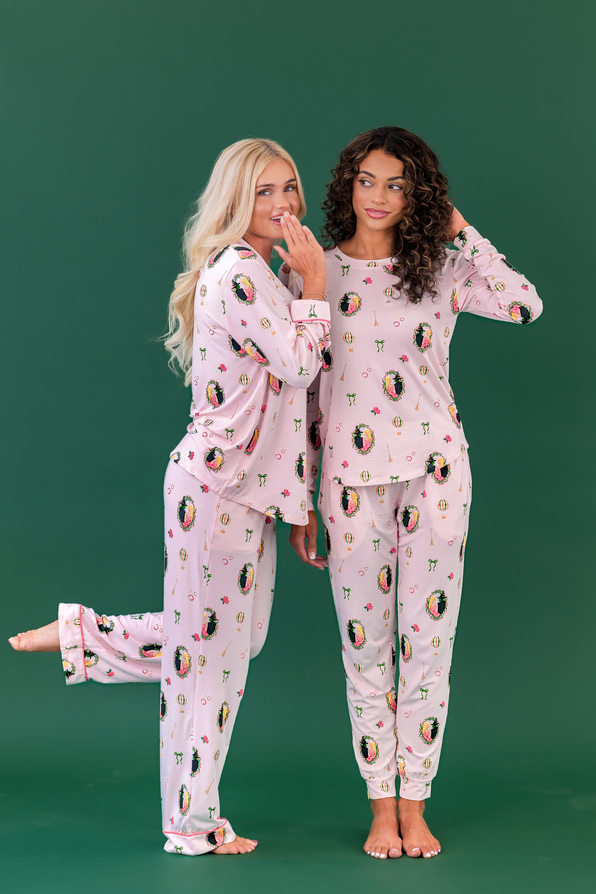 Two female models standing side by side wearing the long sleeve women's pajama set and Women's Jogger Pajama Set in Wicked