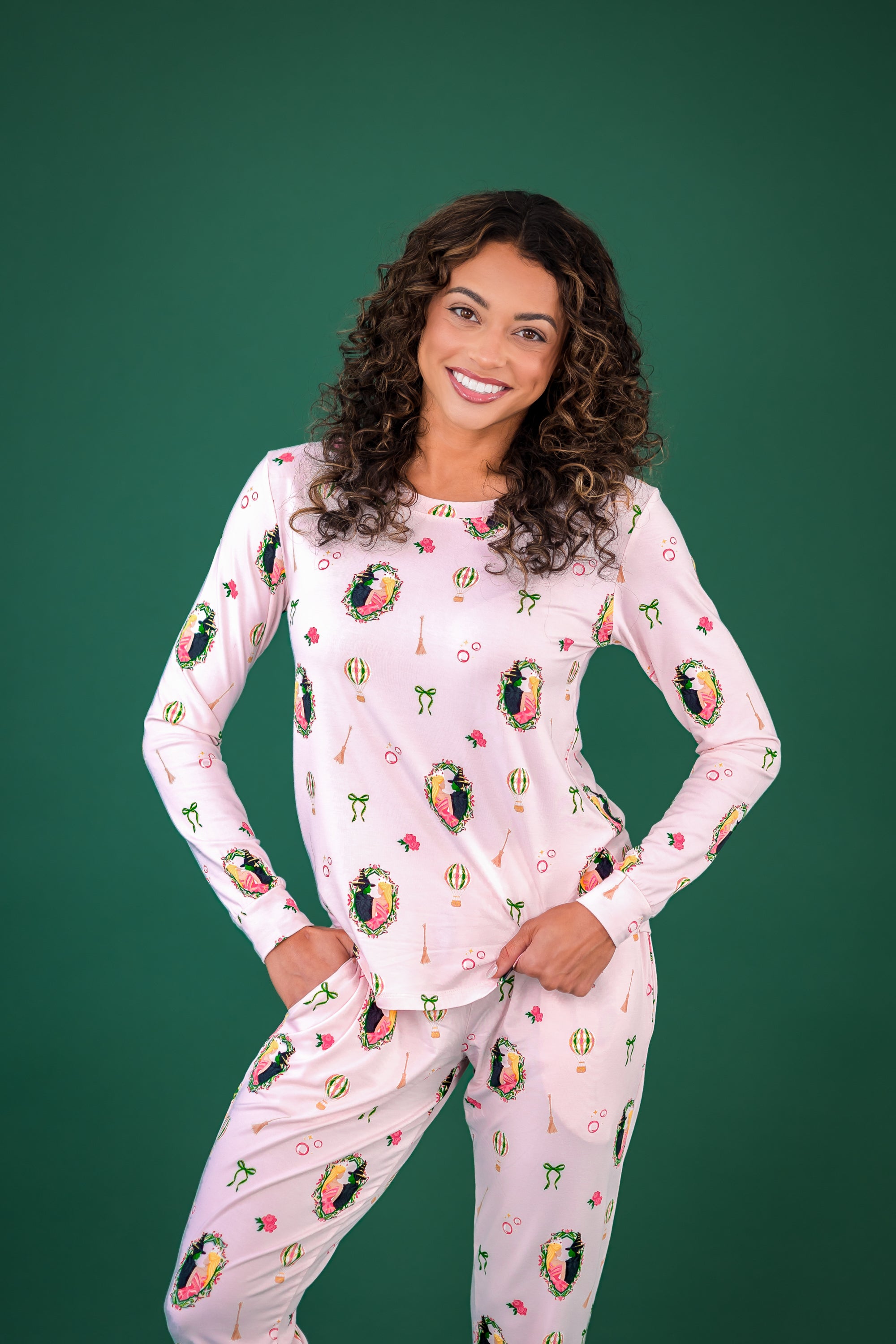 Smiling model wearing the Women's Jogger Pajama Set in Wicked with both hands in the pants pocket
