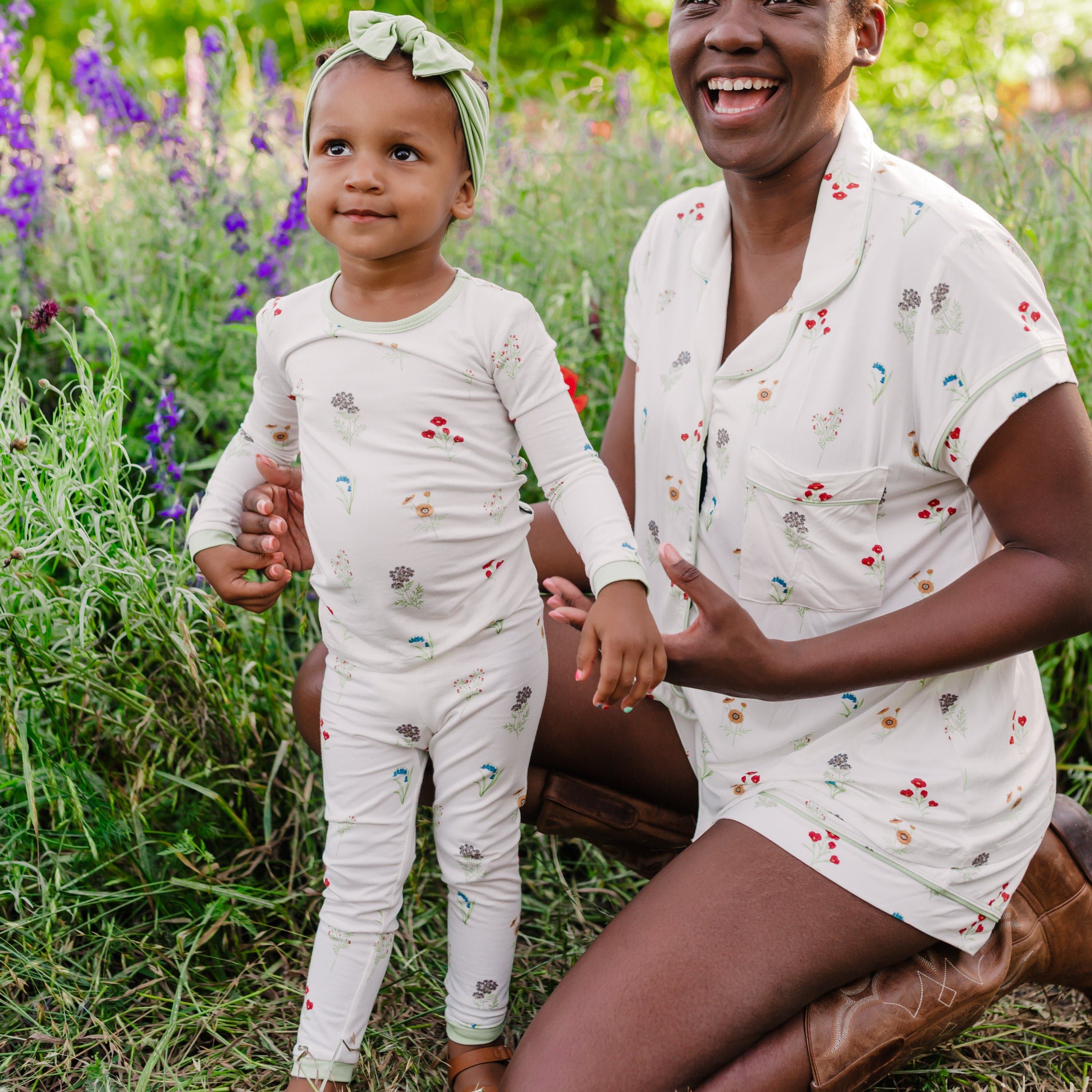 Woman modeling Women’s Short Sleeve Pajama Set in Wildflower next to toddler in matching long sleeve pajamas