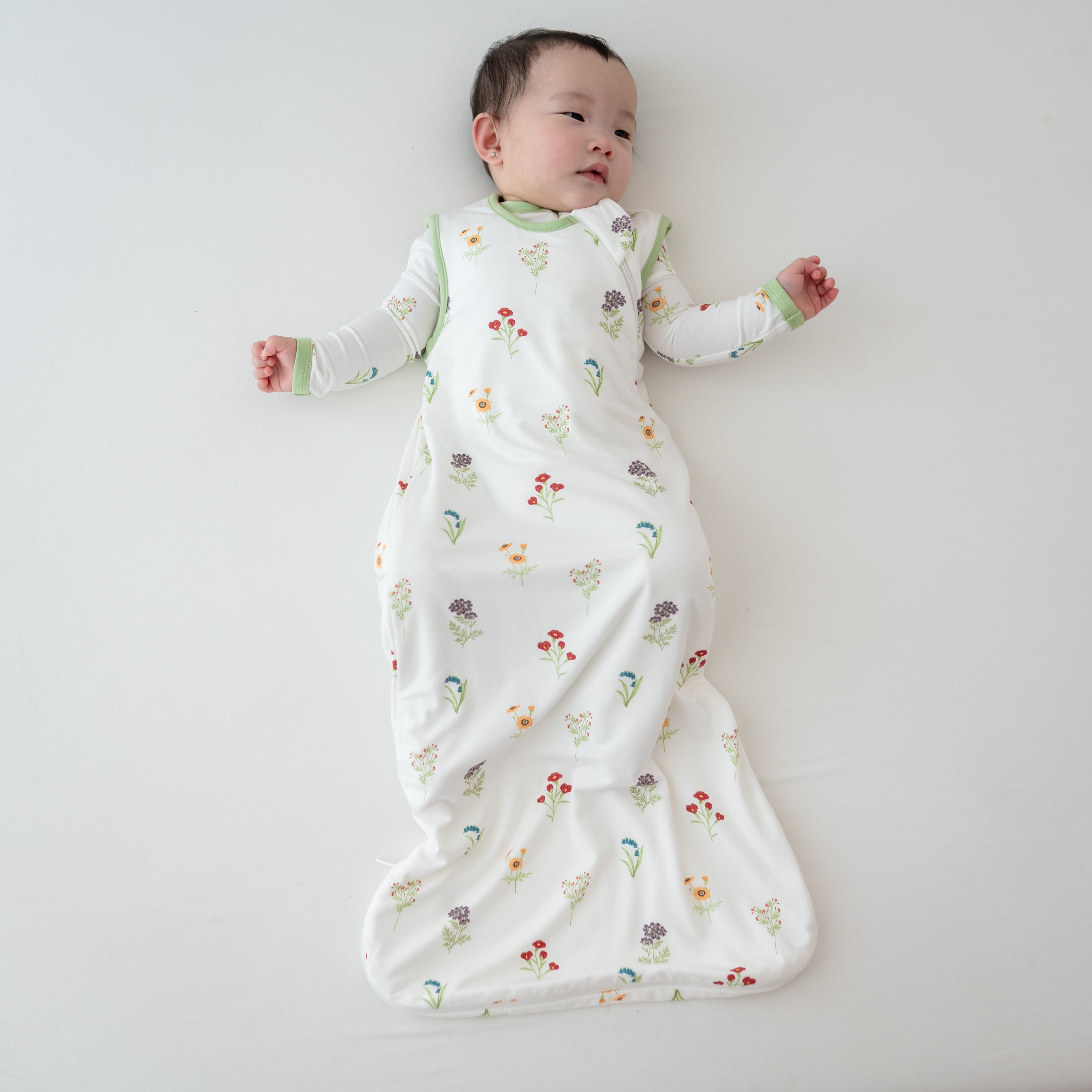 Baby wearing Sleep Bag in Wildflower 0.5