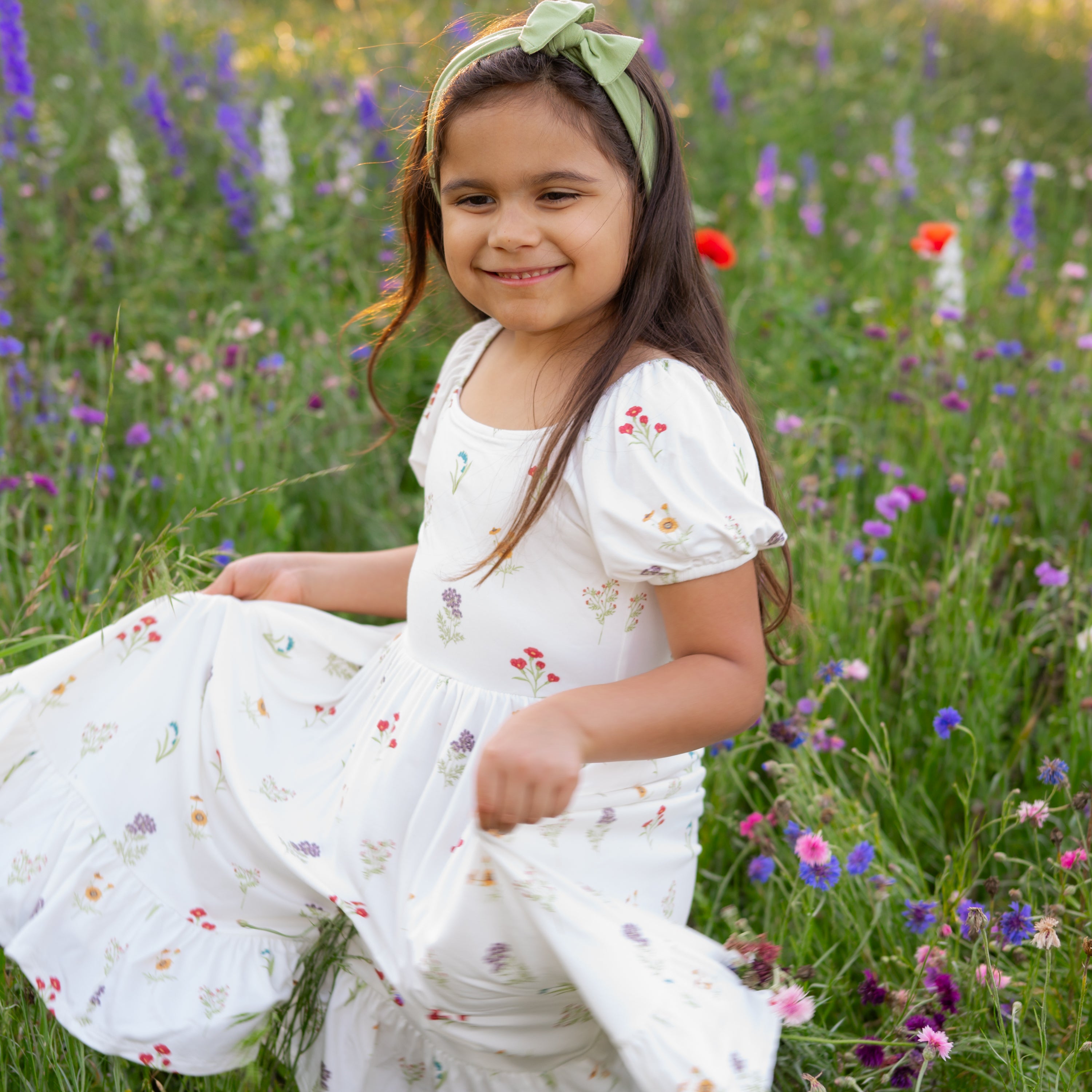 Child twirling in Puff Sleeve Twirl Dress in Wildflower