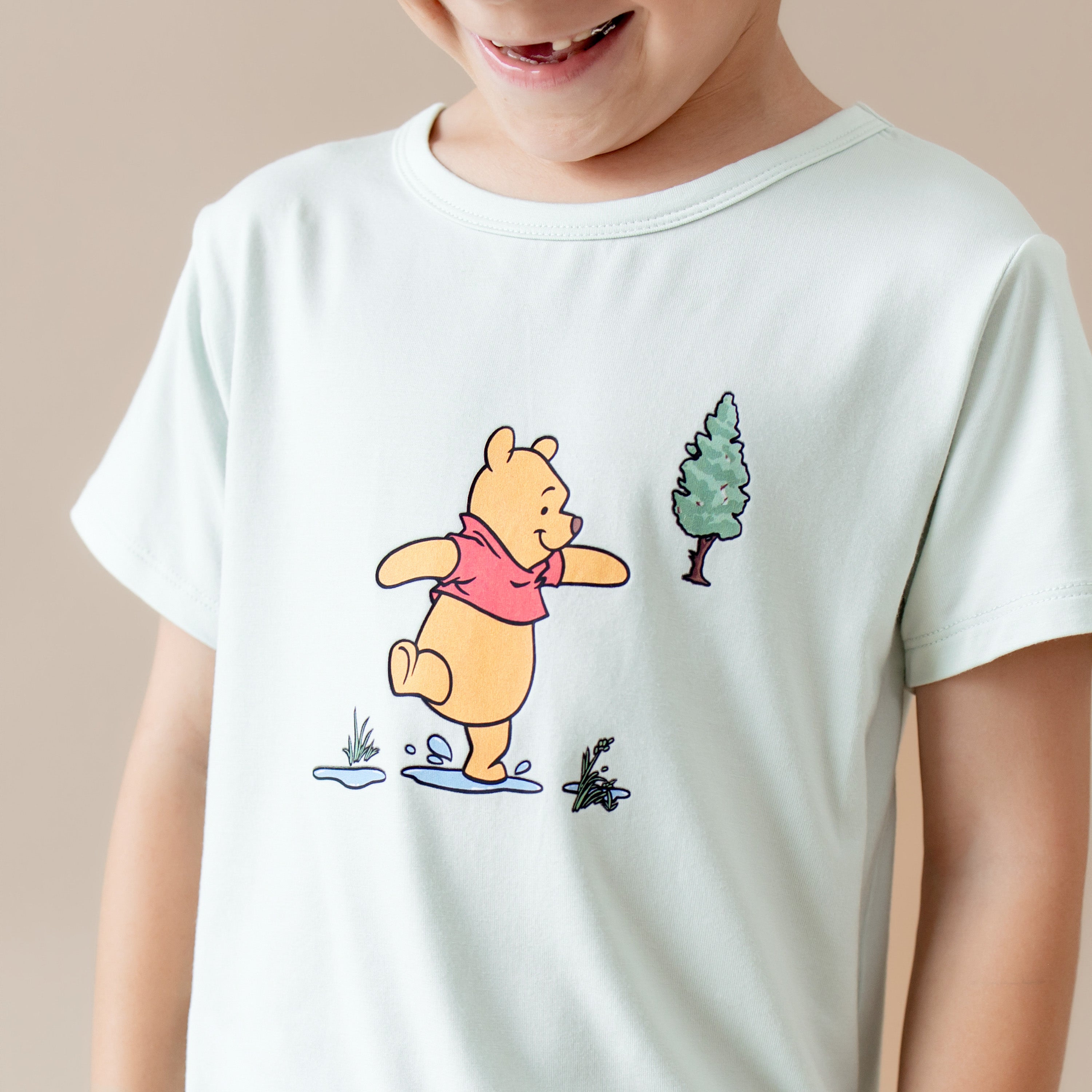 Close up of the winnie the pooh character shown on the Toddler Basic Tee in Winnie the Pooh on Dew