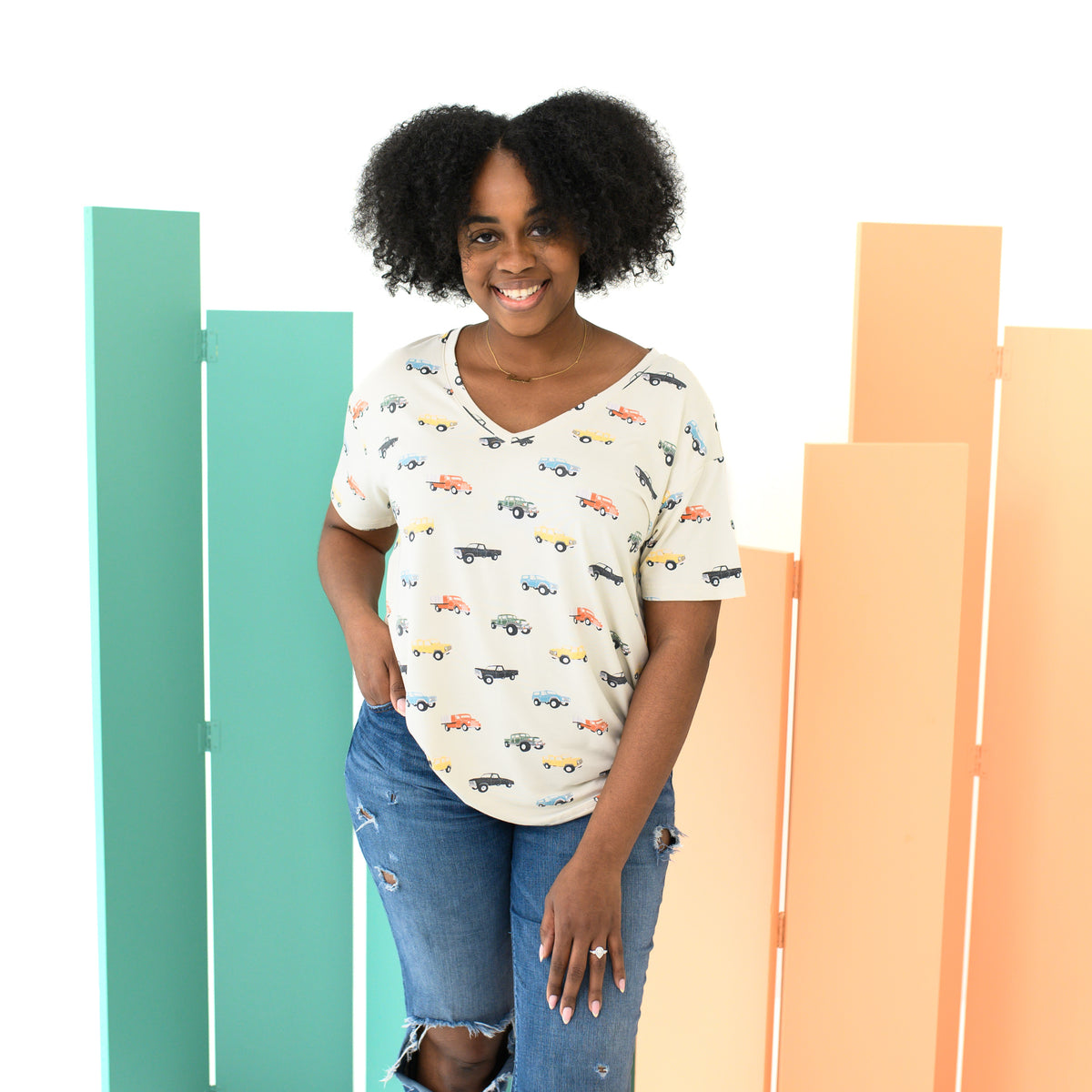 Woman wearing Women’s Relaxed Fit V-Neck in Vintage Truck