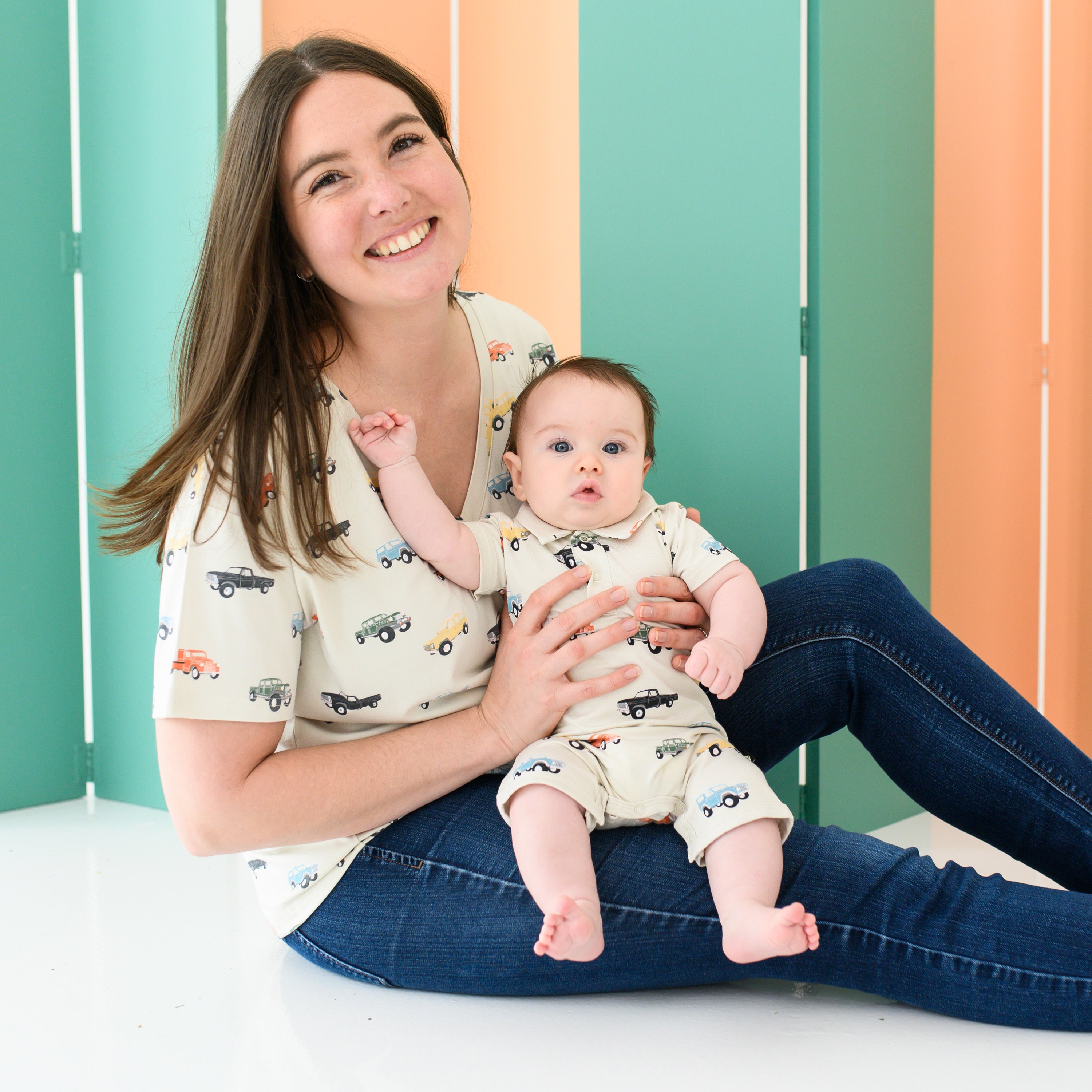 Mom and Baby wearing matching Mommy and Me outfits in Vintage Truck