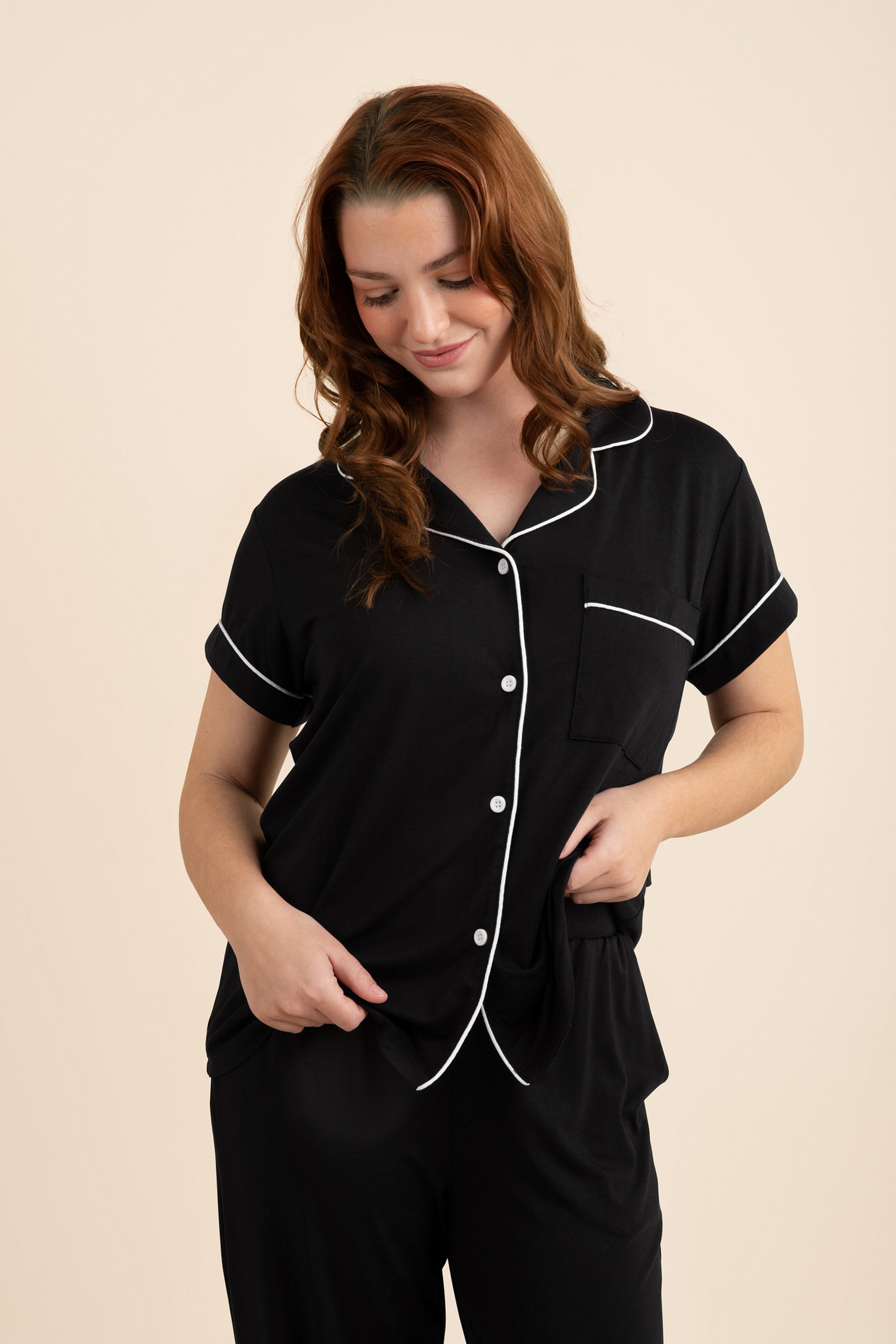 Close up of the model wearing the Women's Short Sleeve Cropped Pajama Set in Midnight