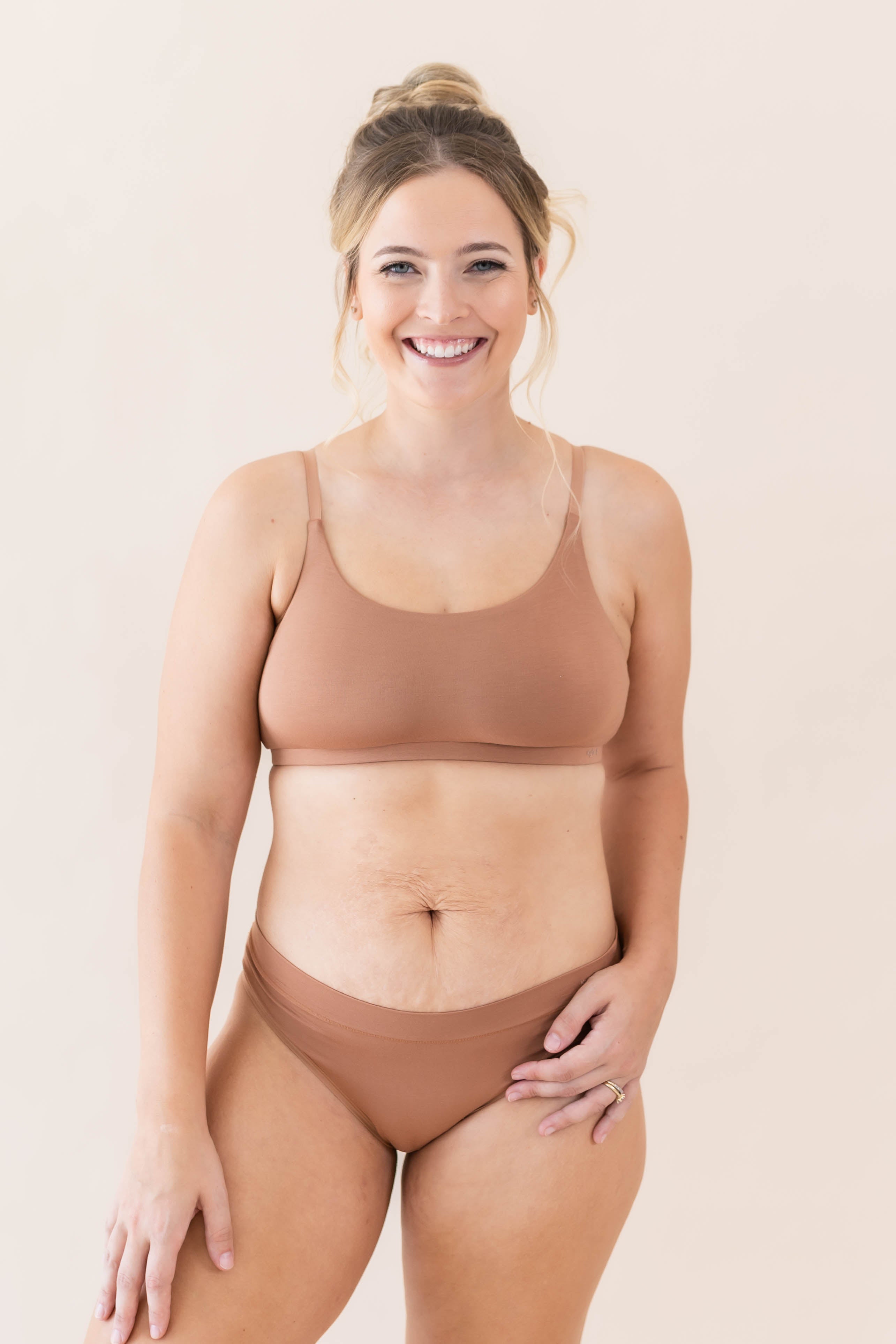 Smiling model wearing the Women's Cheekini in Latte with matching scoop neck bralette