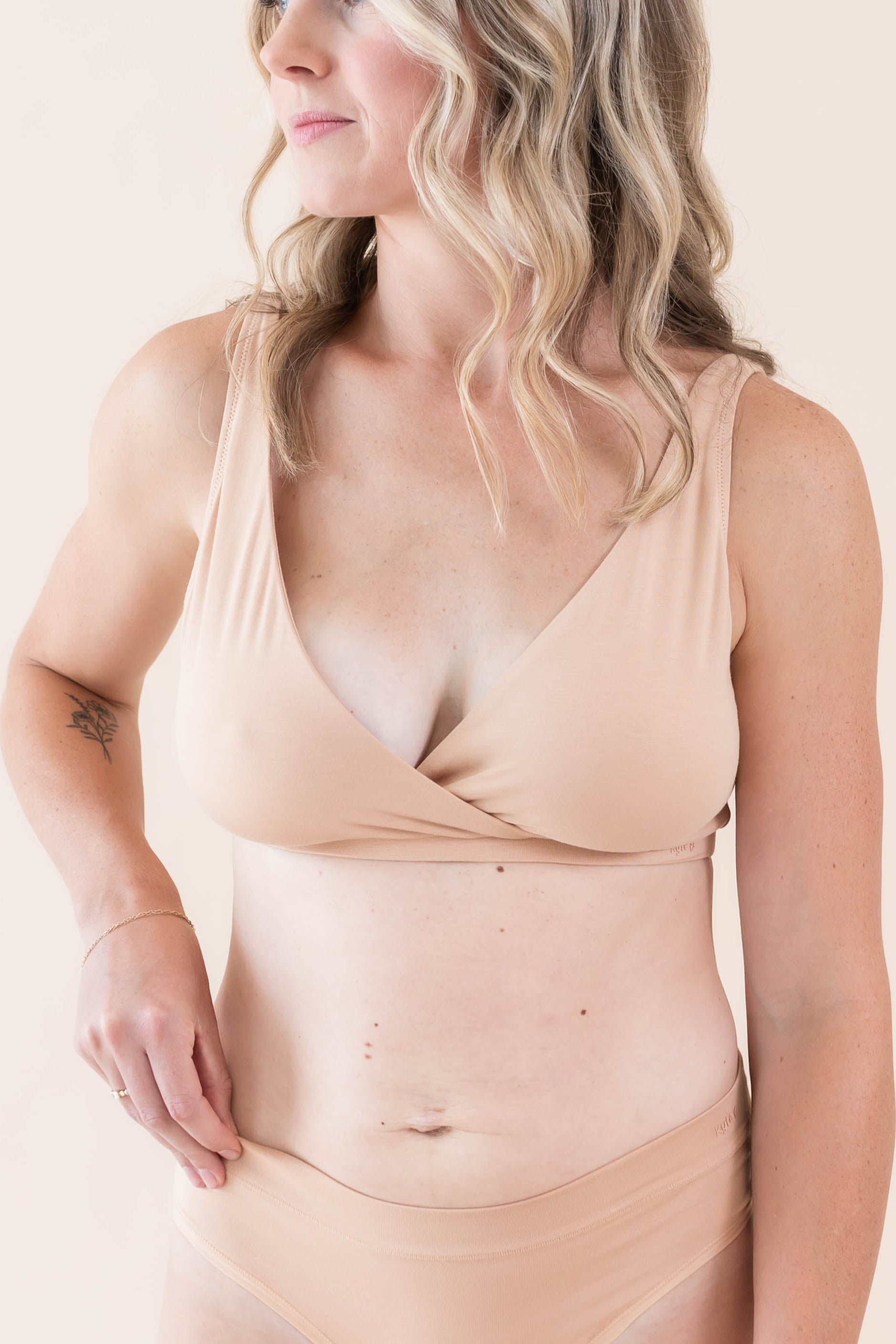 Model wearing the Women's Midi Brief in Chai paired with the cross front bralette