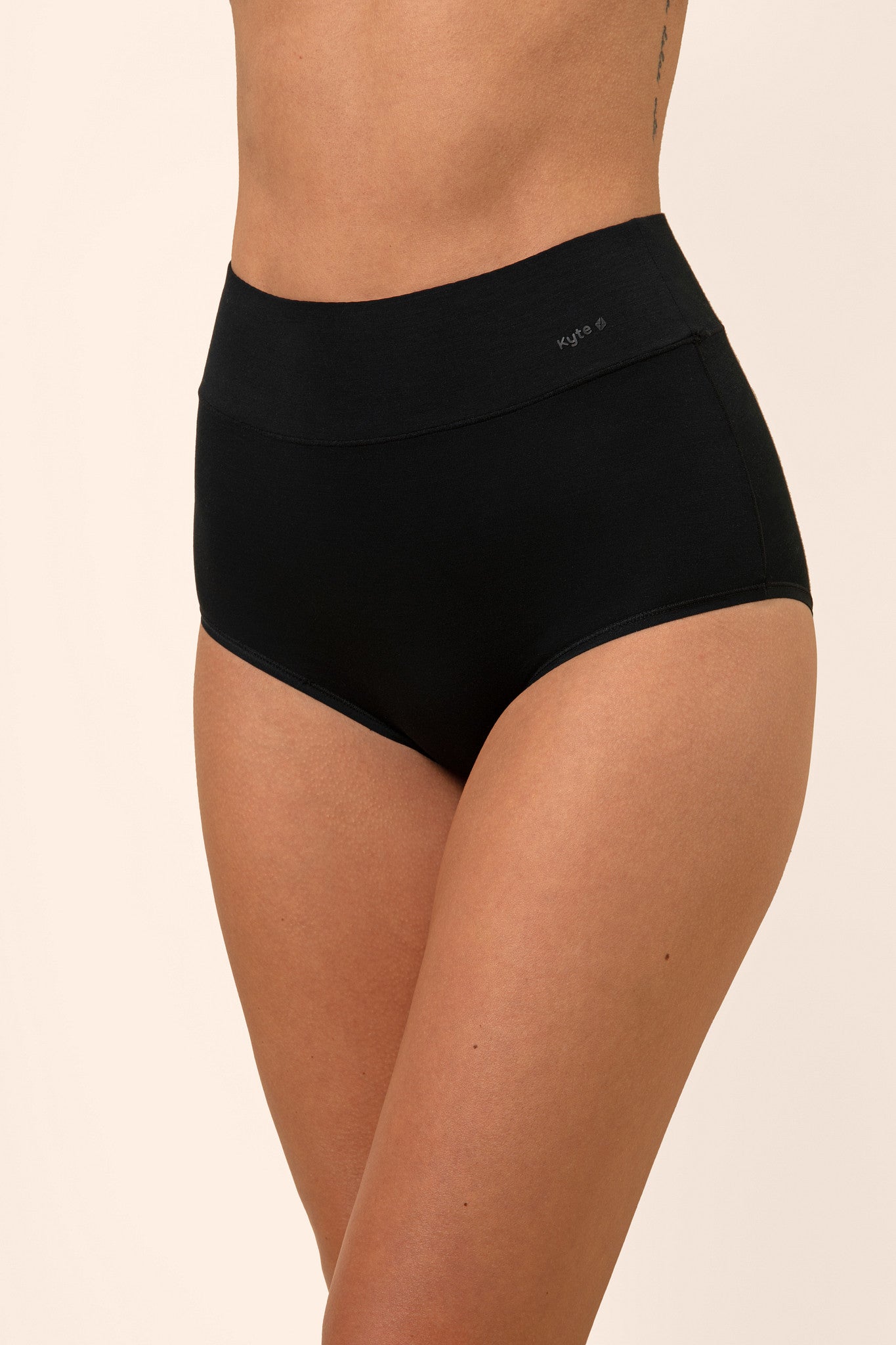 Women's High-Waisted Brief in Midnight shown on a female model