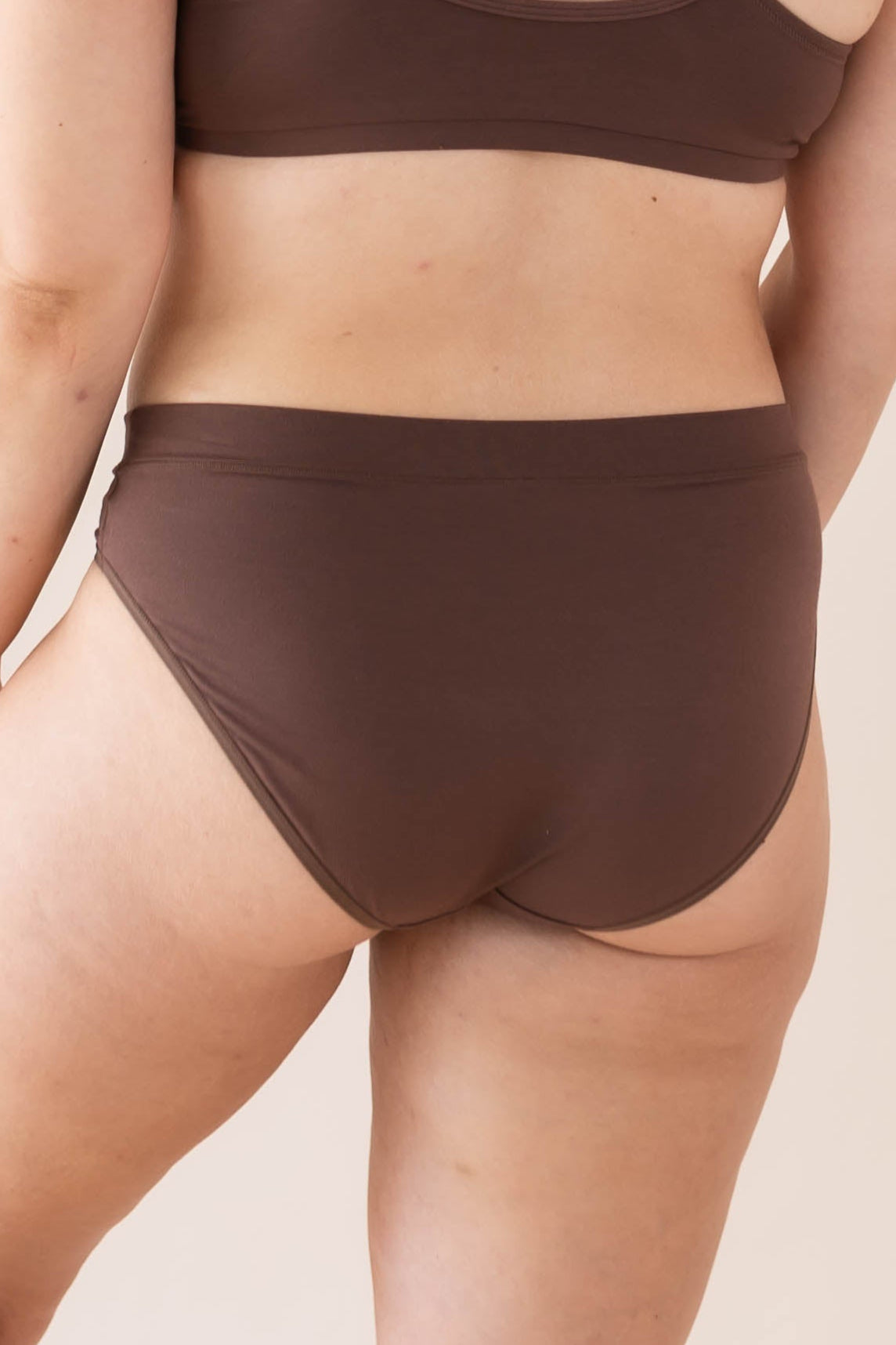 The back of the Women's Midi Brief in Toffee shown on a model