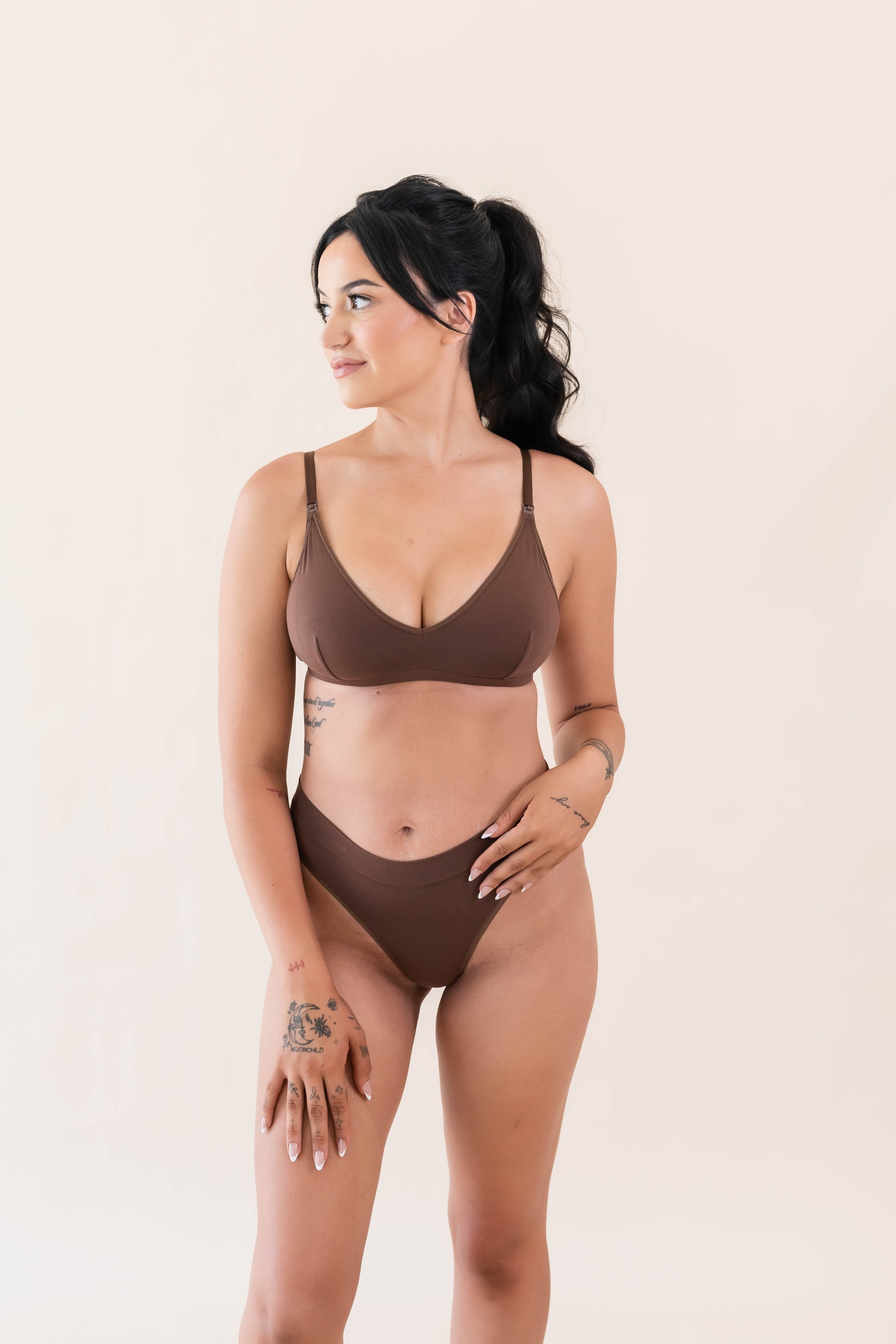 Female modeling the Women's Nursing Bra in Latte wearing matching underwear