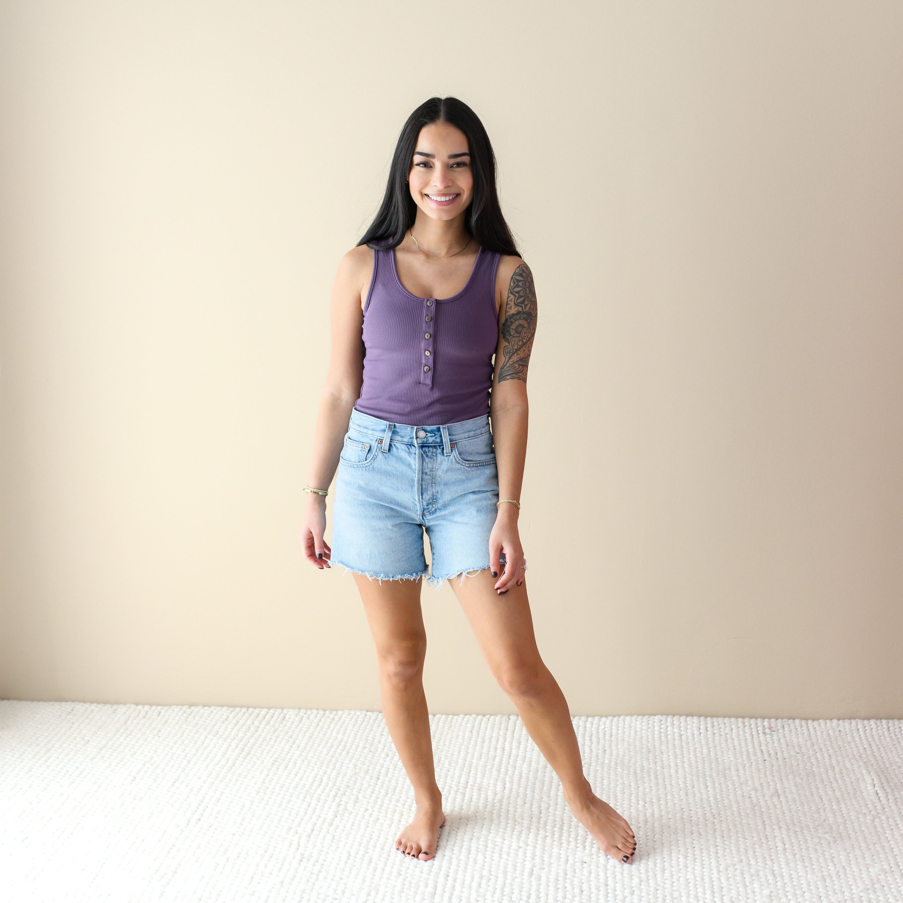 Woman wearing bamboo Ribbed Henley Thong Bodysuit in Currant