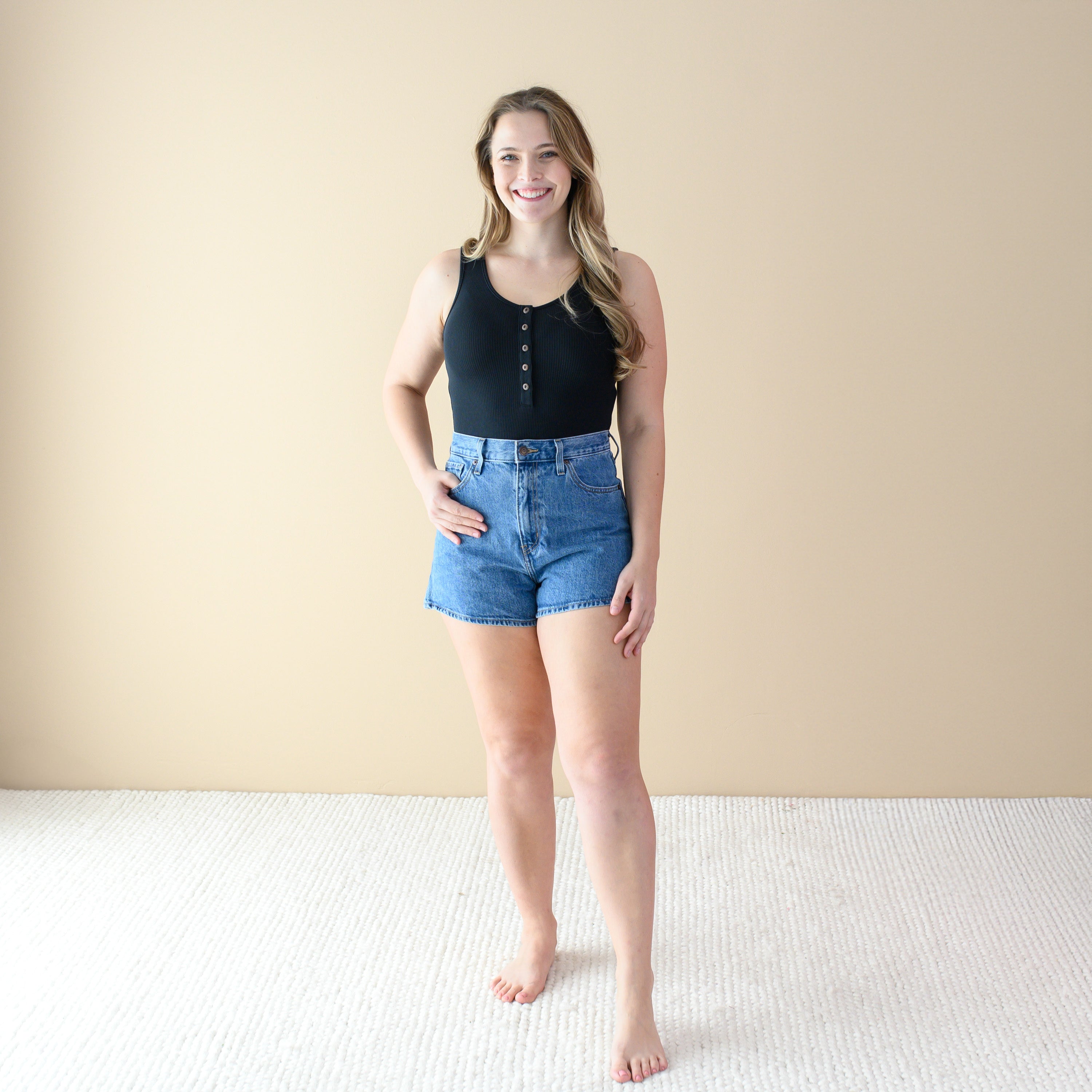 Woman wearing Black Women’s Ribbed Henley Bodysuit