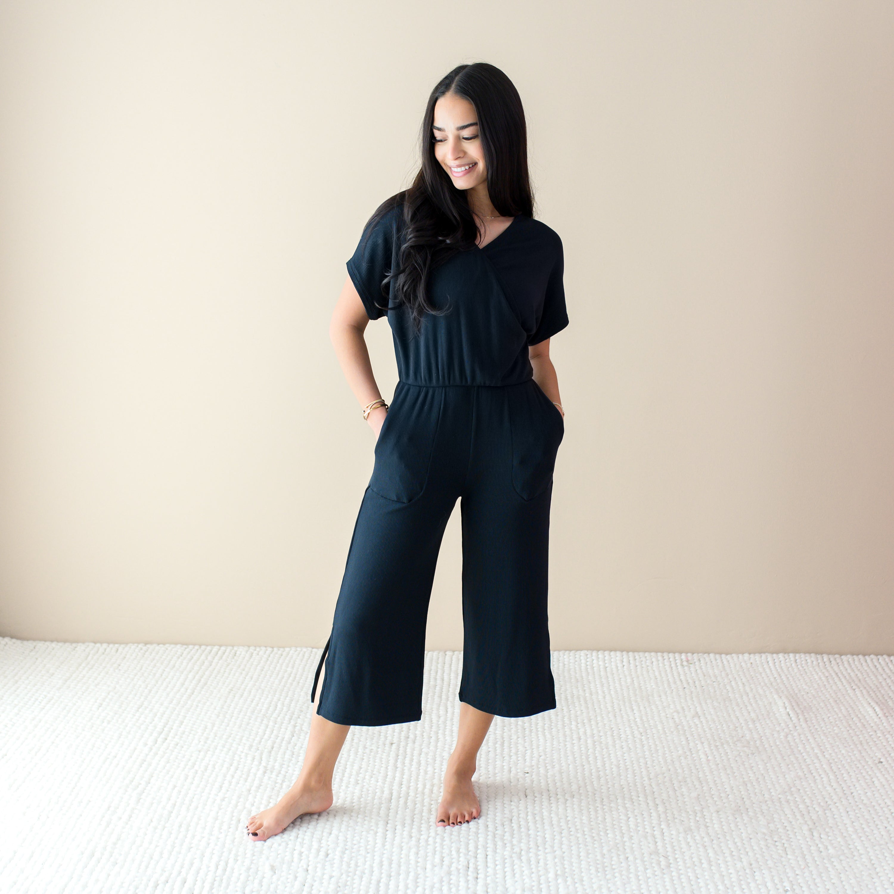 Woman wearing Women's Ribbed Black Jumpsuit with Pockets