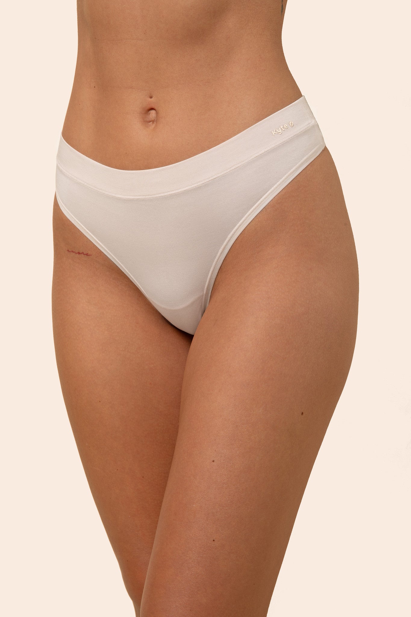 Front of the Women's Thong in Blonde on a female model