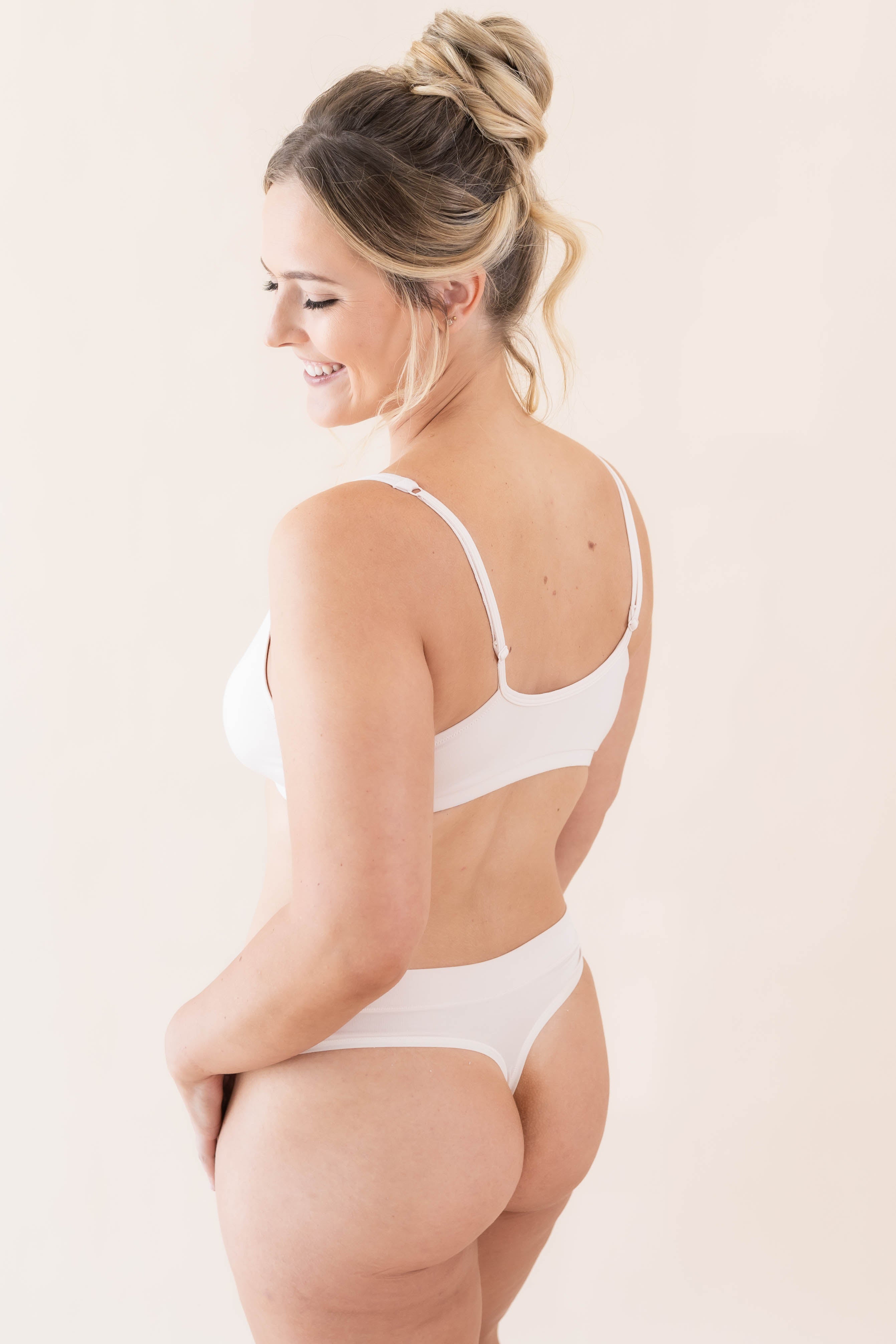 Close up of model wearing the Women's Thong in Blonde with matching bralette