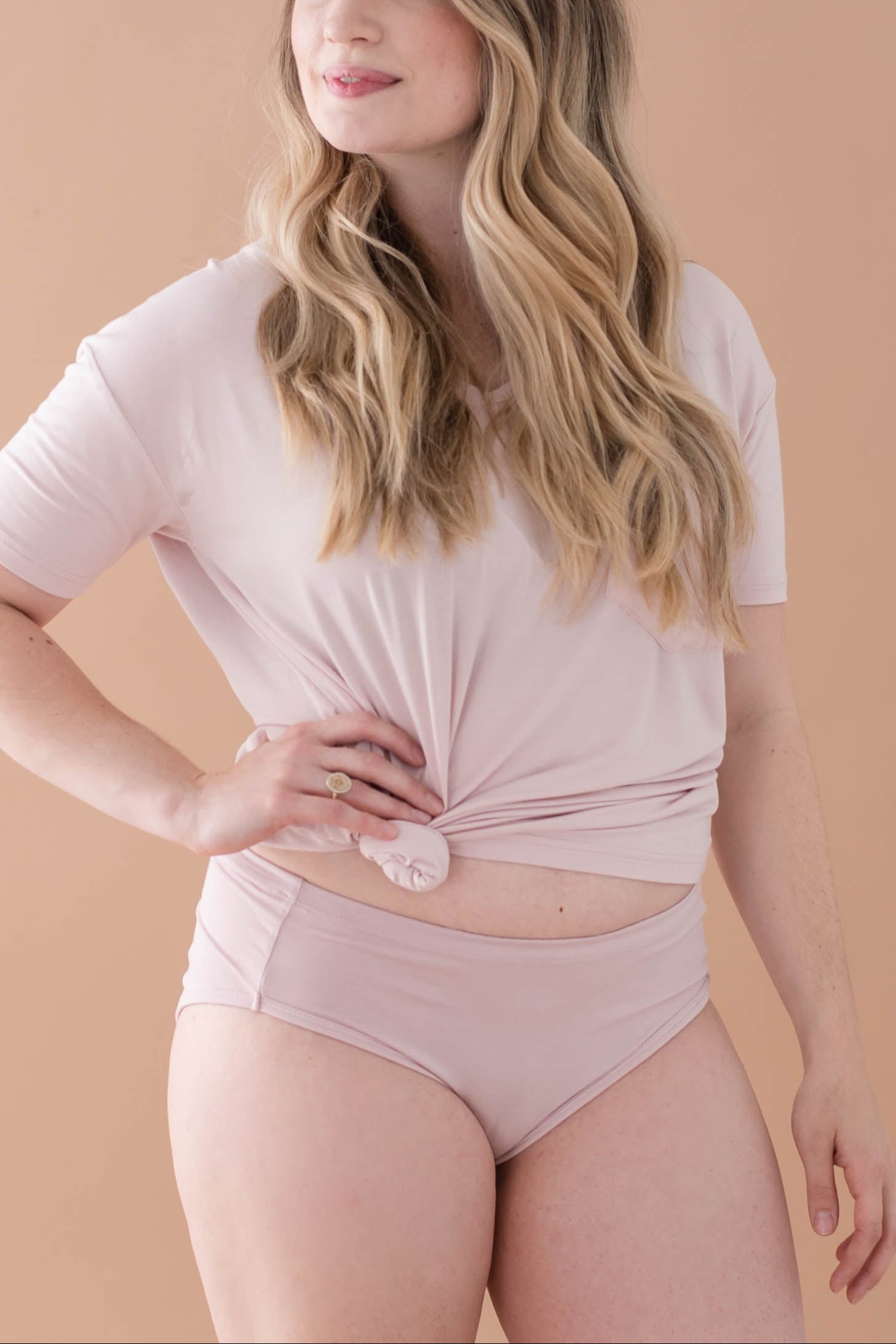 Female model posing wearing the with matching knotted v-neck