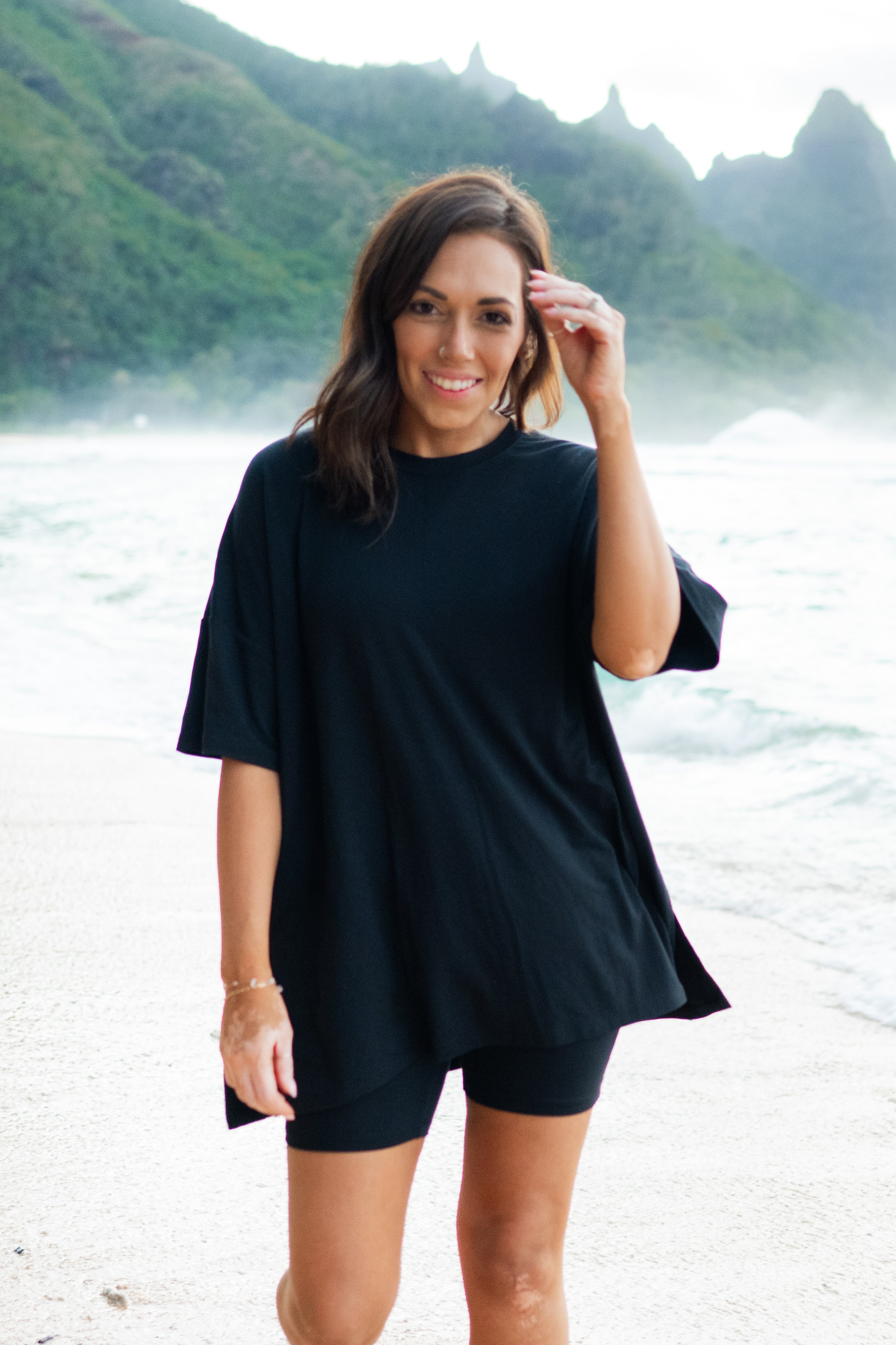 Woman modeling Women’s Biker Short Set in Midnight on the beach