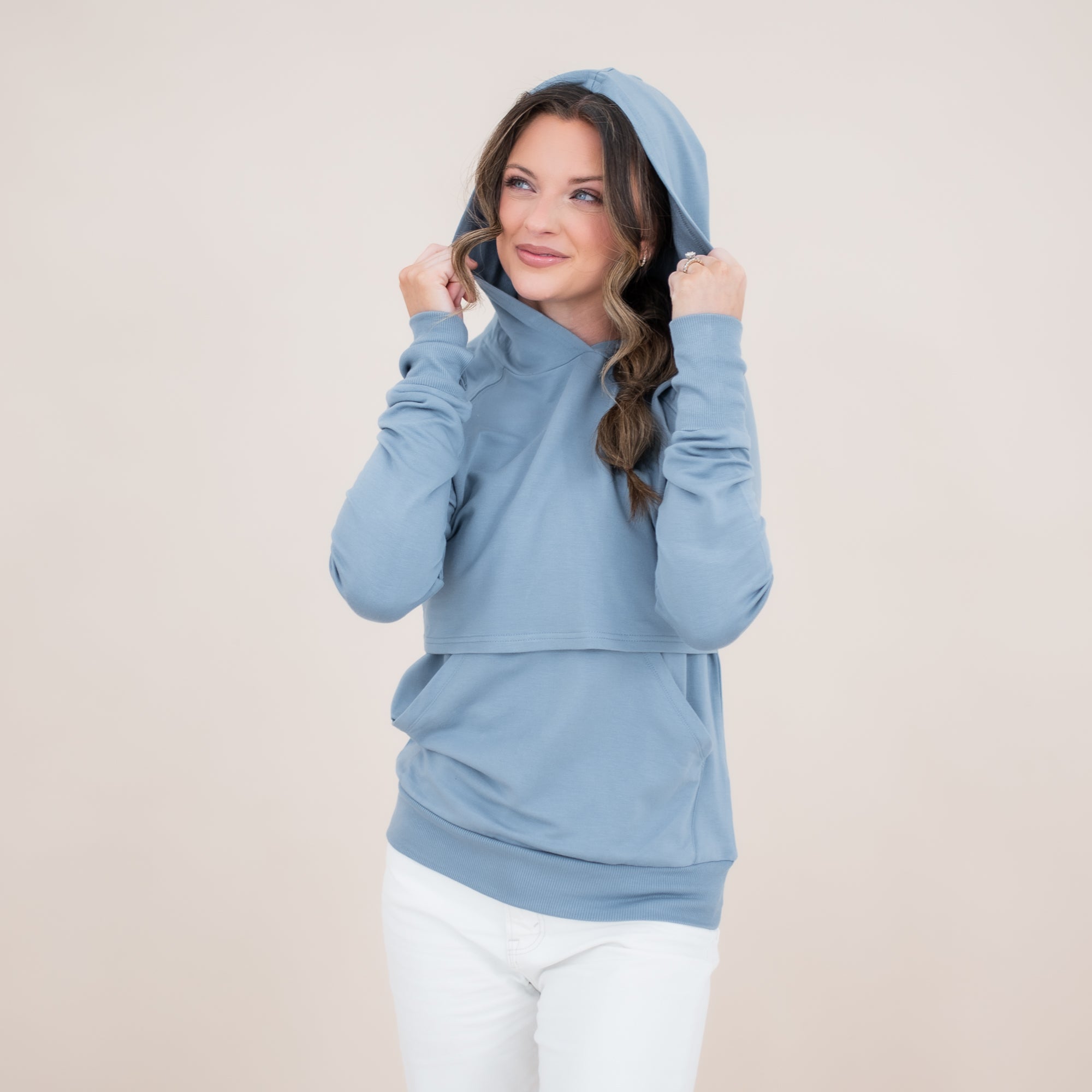 Female model wearing the Women's French Terry Nursing Hoodie in Slate with the hood up