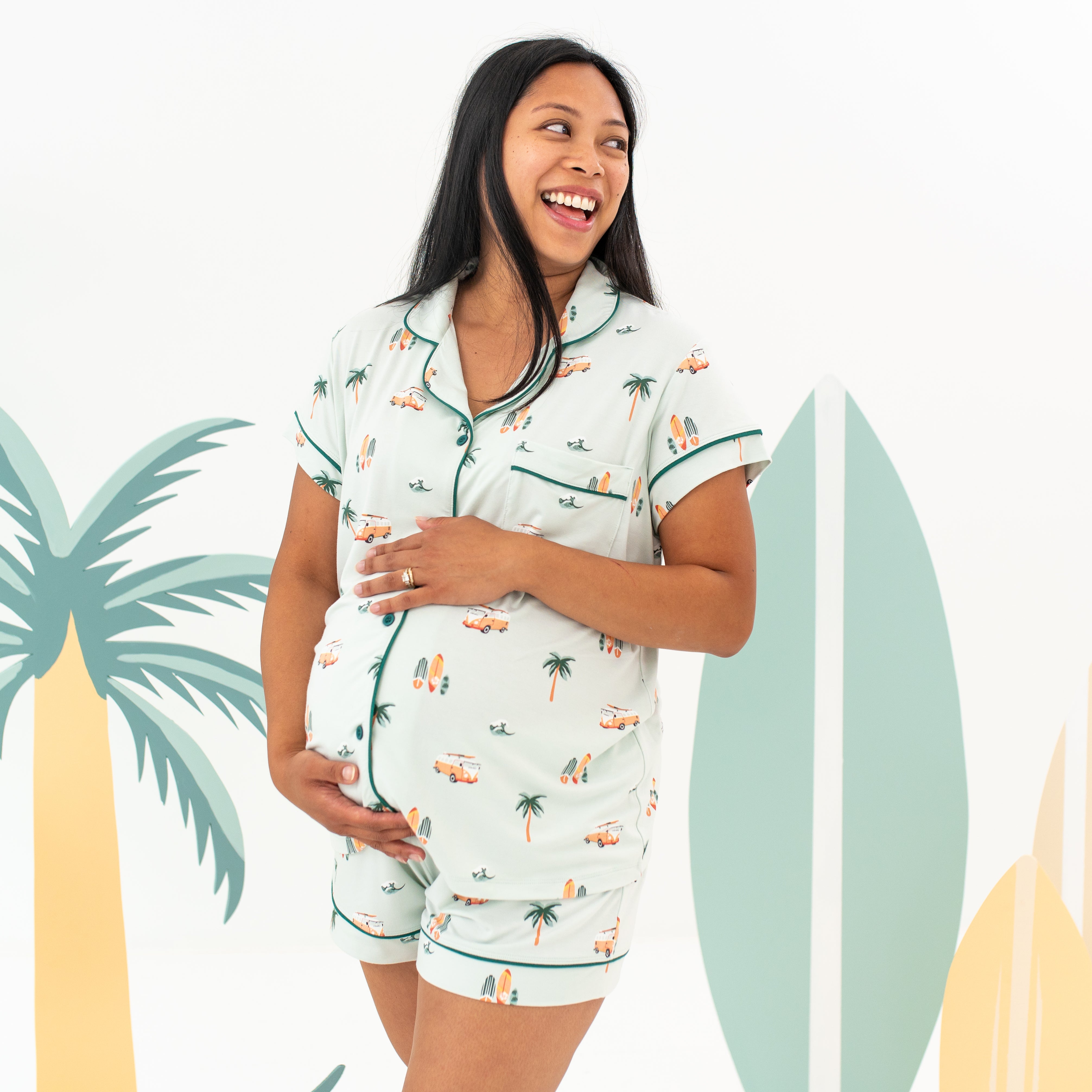 Pregnant woman modeling Women's Short Sleeve Pajama Set in Dew Surf with surf backdrop